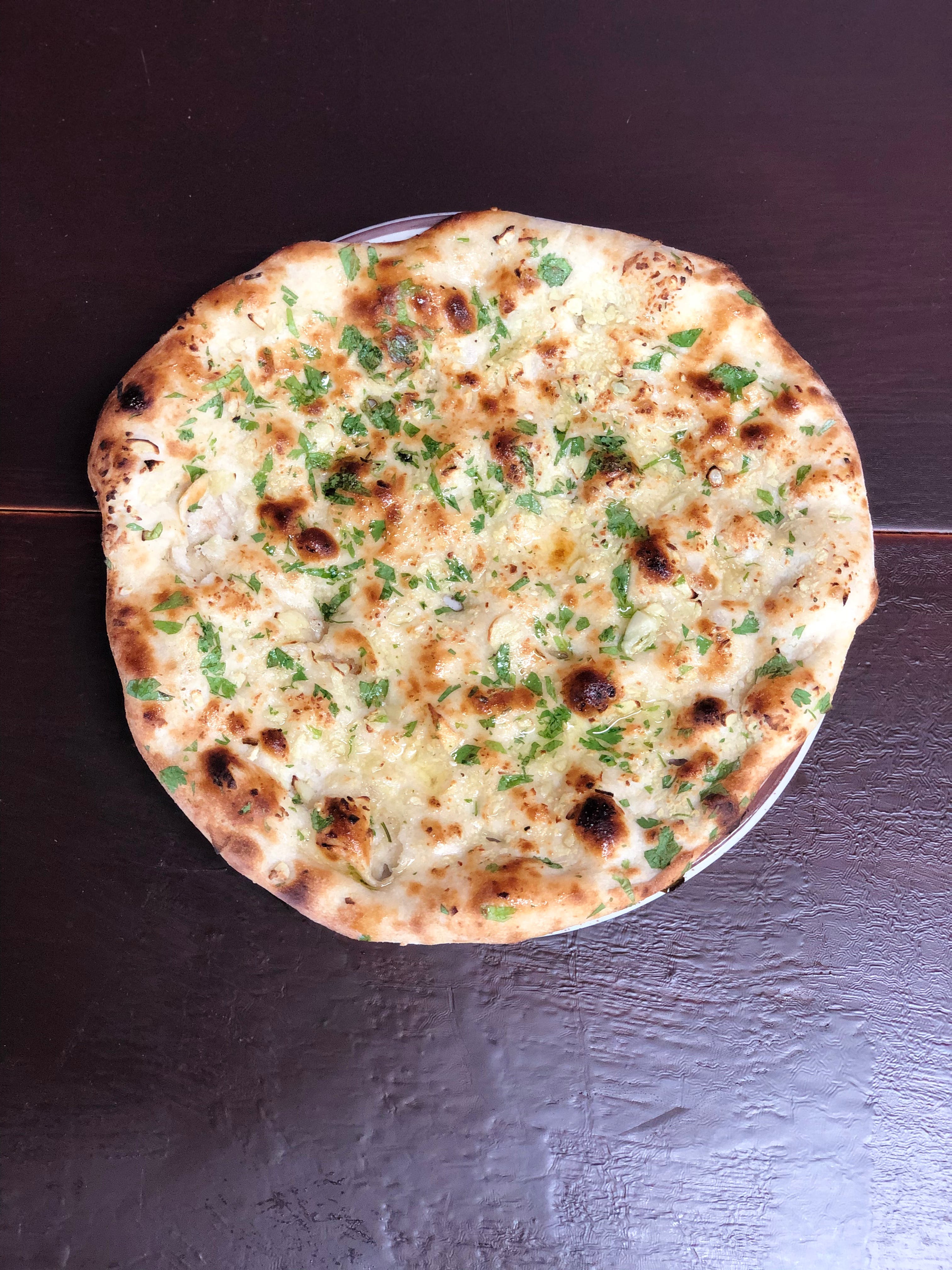 Order Garlic Naan Flatbread Pizza 2Pcs - Side food online from Man O Salwa store, Windsor Mill on bringmethat.com