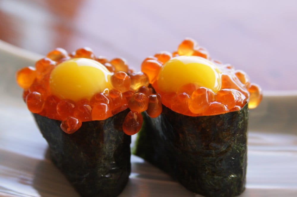 Order Iku-Tama (Salmon roe w/quail egg) Nigiri food online from Tgi Sushi store, San Jose on bringmethat.com