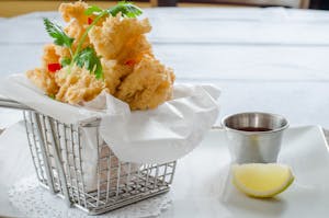 Order Fried Calamari food online from Rice Factory Thai Restaurant store, Milltown on bringmethat.com