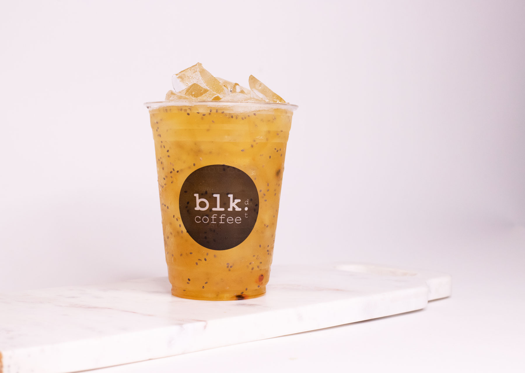 Order Iced Exotic Passion Green Tea food online from Blk Dot Coffee store, Irvine on bringmethat.com