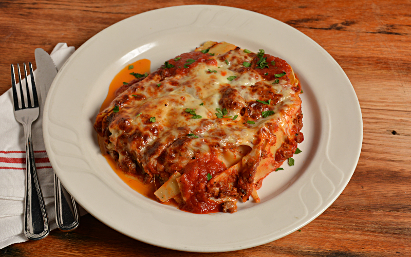 Order Mama Cinelli's Lasagna food online from Cinelli's Pizza store, Franklin Square on bringmethat.com