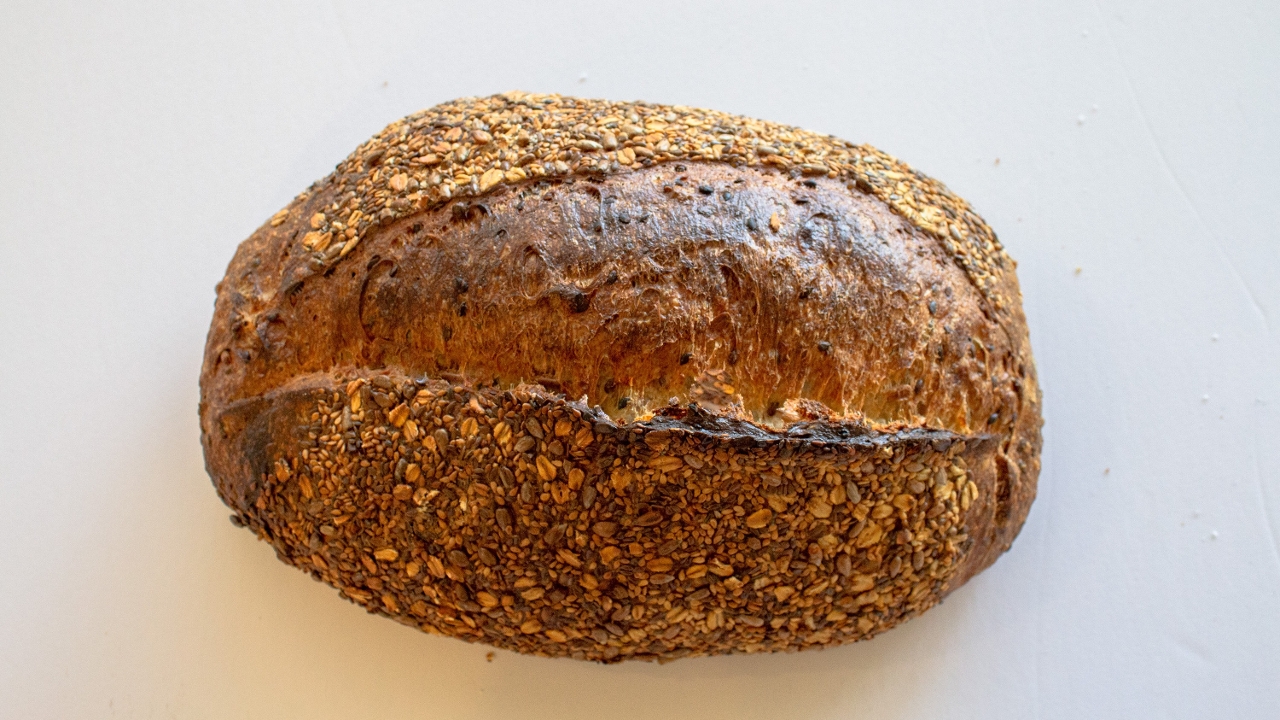 Order Flax Sunflower Sourdough full loaf food online from Rustic Bakery store, Belvedere Tiburon on bringmethat.com