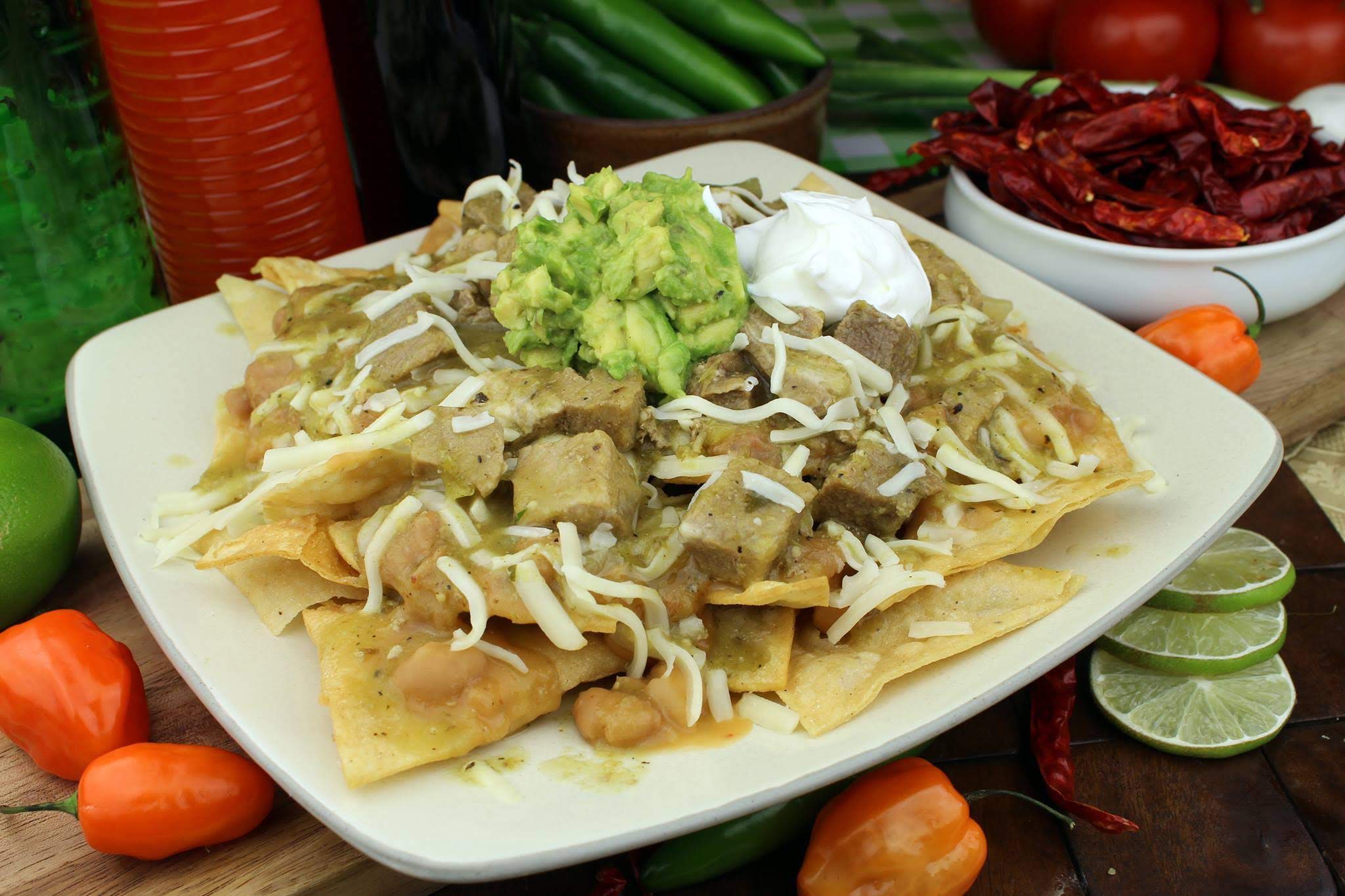 Order Chile Verde Nachos  food online from Que Buena Taqueria store, Whittier on bringmethat.com