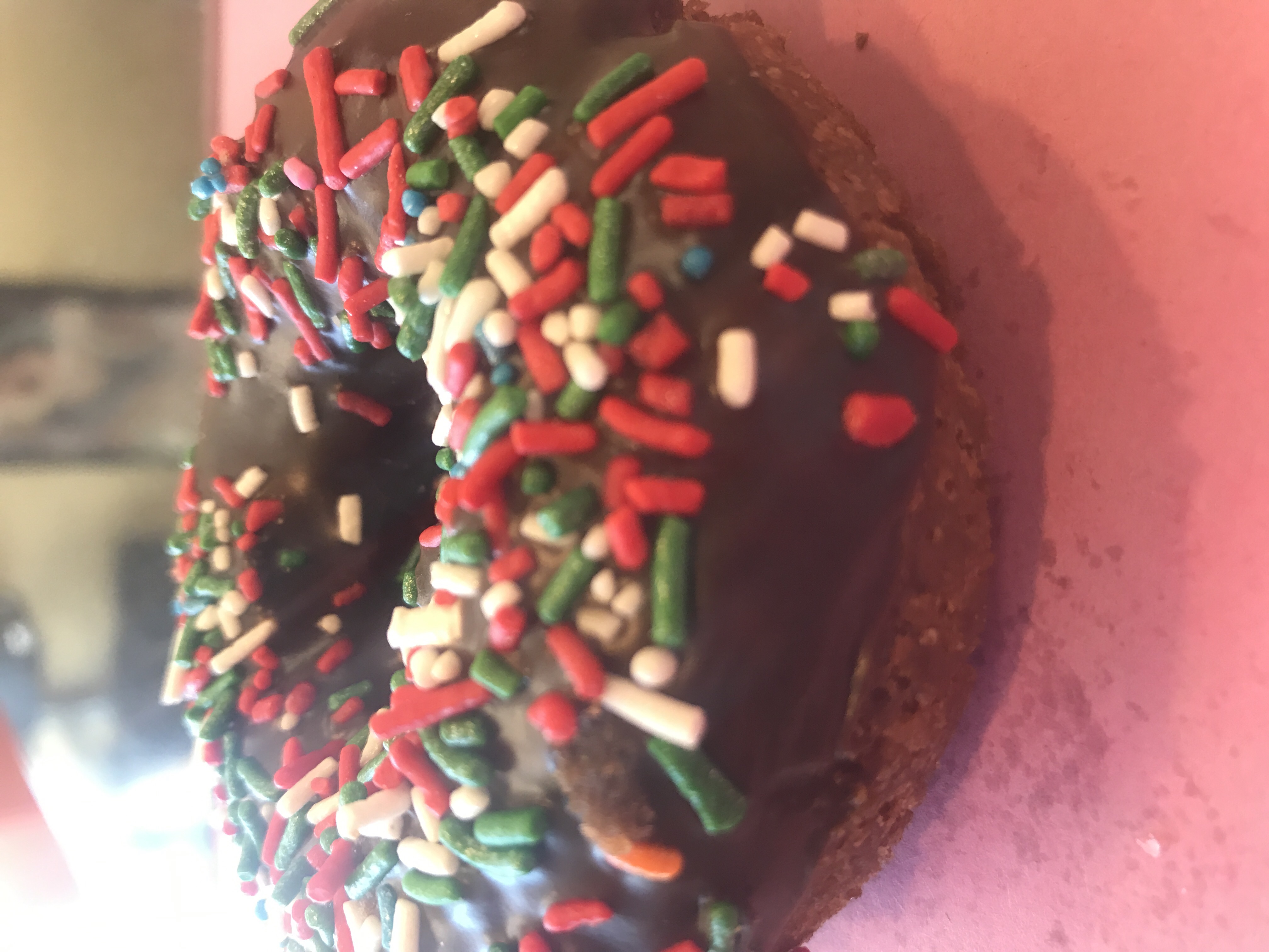 Order Chocolate Cake Donut with Rainbow Sprinkle food online from Angel Panama Lane Donuts store, Bakersfield on bringmethat.com