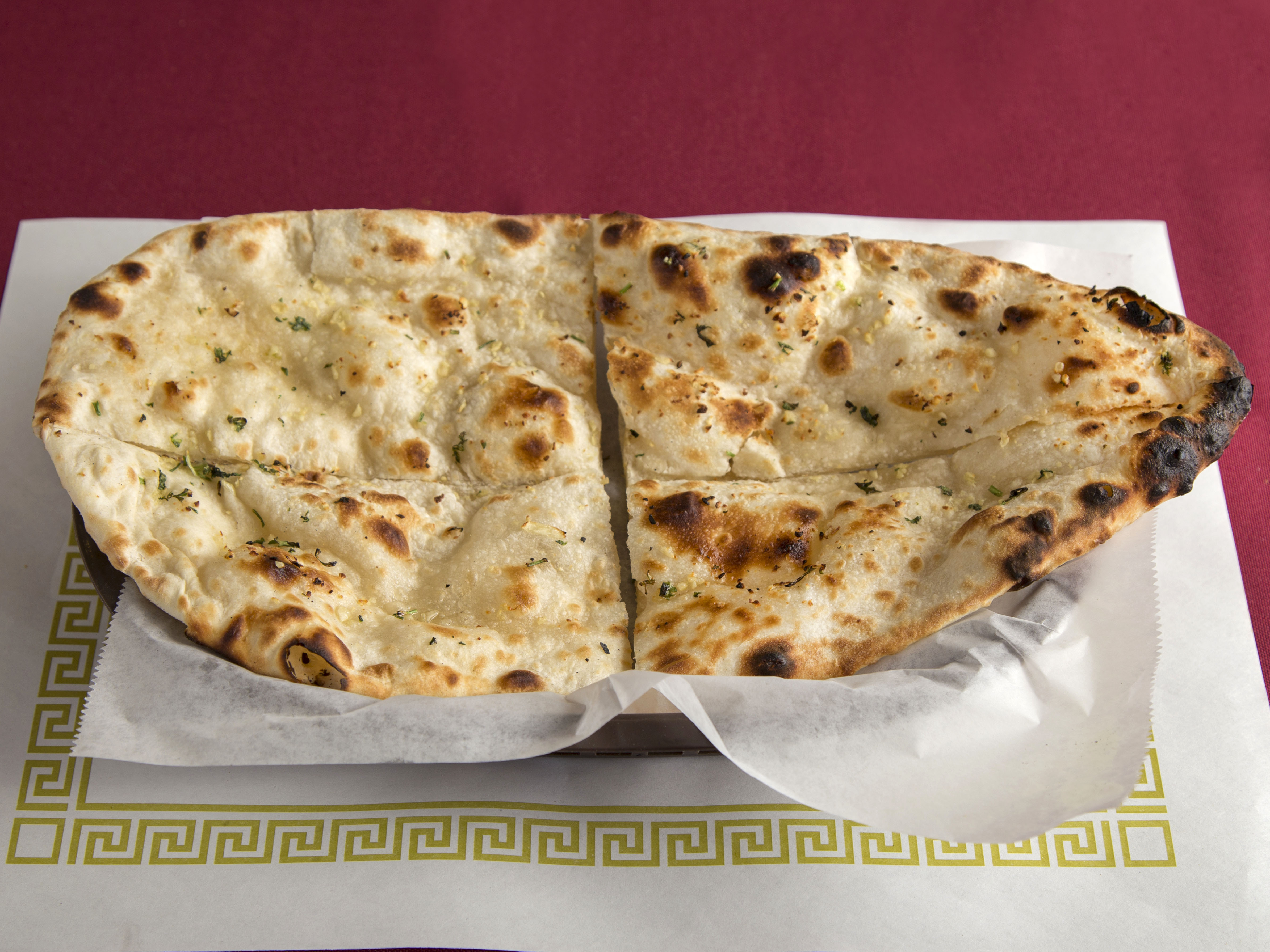 Order Garlic Naan food online from New India Gate store, Chandler on bringmethat.com