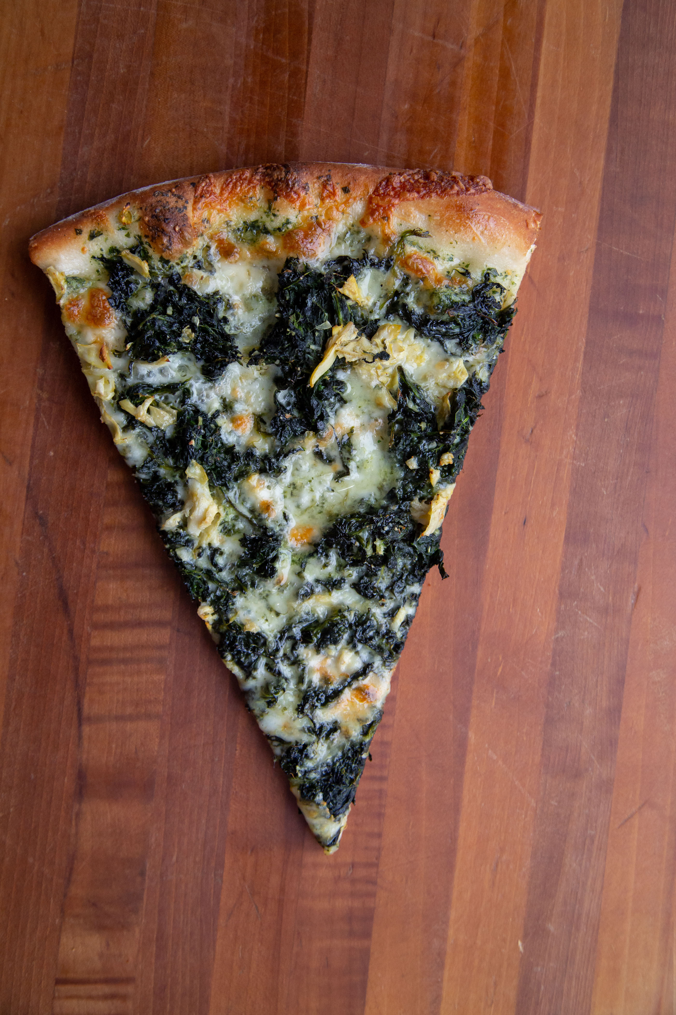 Order Spinach and Artichoke Pie Slice food online from We The Pizza store, Arlington on bringmethat.com