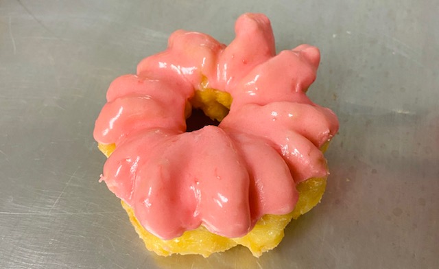 Order Pink French Cruller food online from Highland Donuts store, Bakersfield on bringmethat.com
