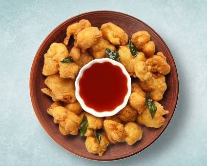 Order Batter Fried Veggie Pakodas   food online from Eternal Clay Pot store, Youngstown on bringmethat.com