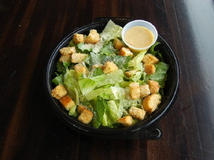 Order Caesar Salad - Large food online from Claymont Steak Shop store, Claymont on bringmethat.com