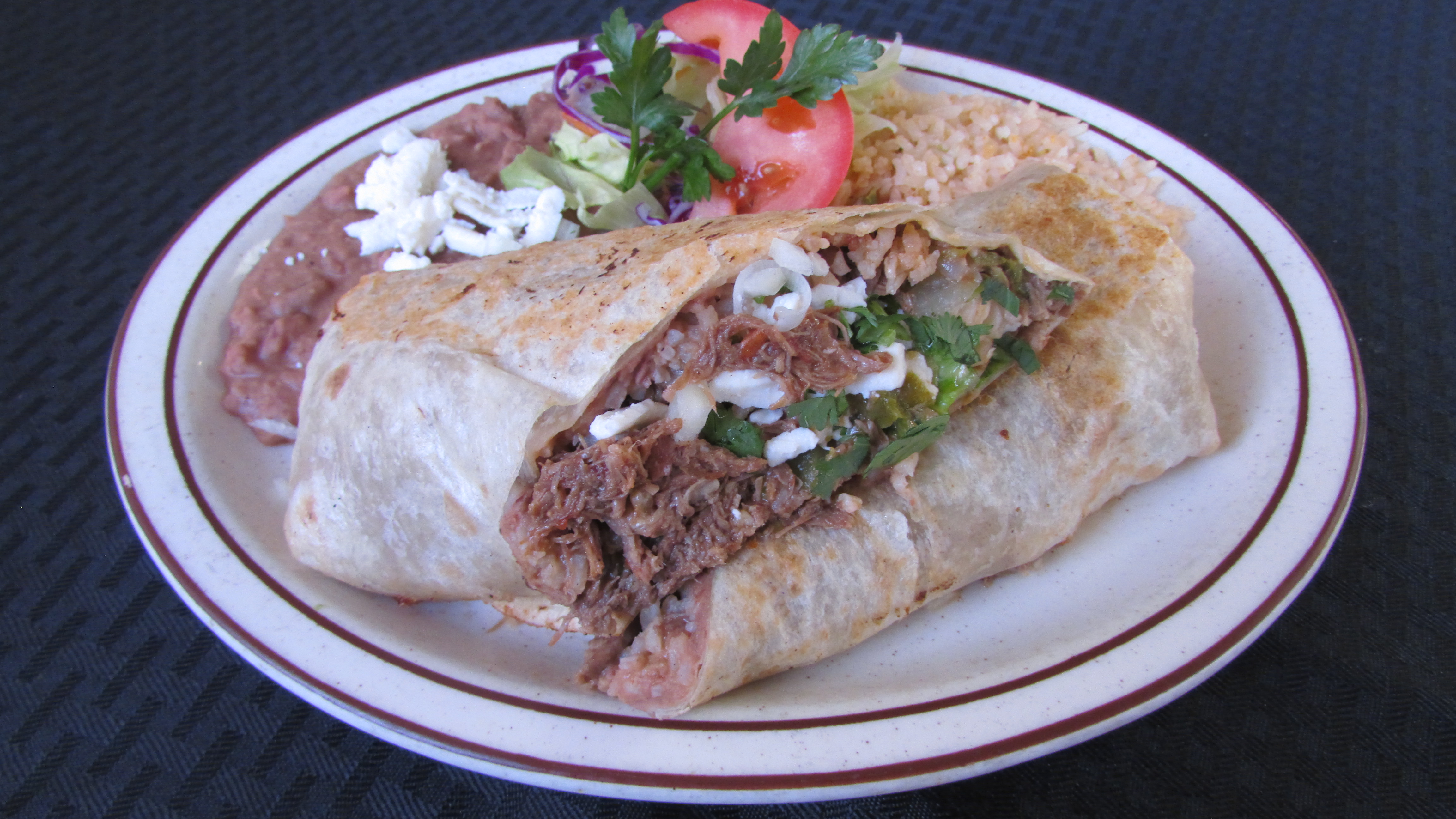 Order Shredded Beef Burrito Ranchero food online from Tortillas Restaurant store, Cathedral City on bringmethat.com