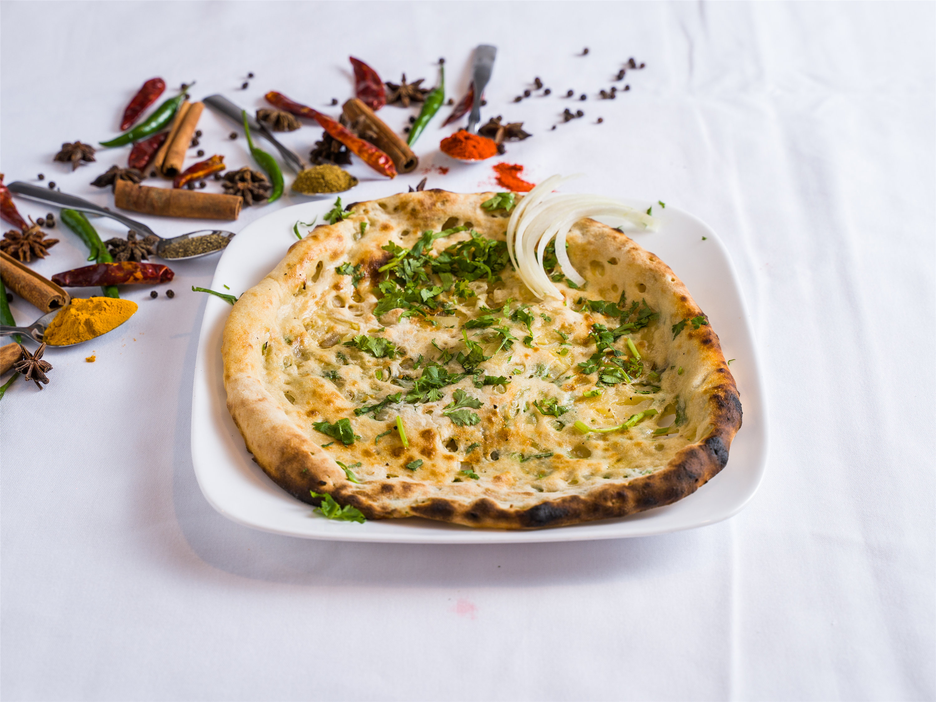 Order Onion Kulcha food online from Cotillion store, Jericho on bringmethat.com