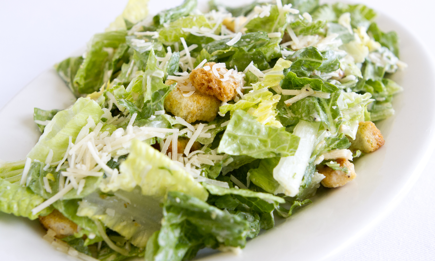 Order Caesar Salad food online from Milan Pizzeria store, Royal Oak on bringmethat.com