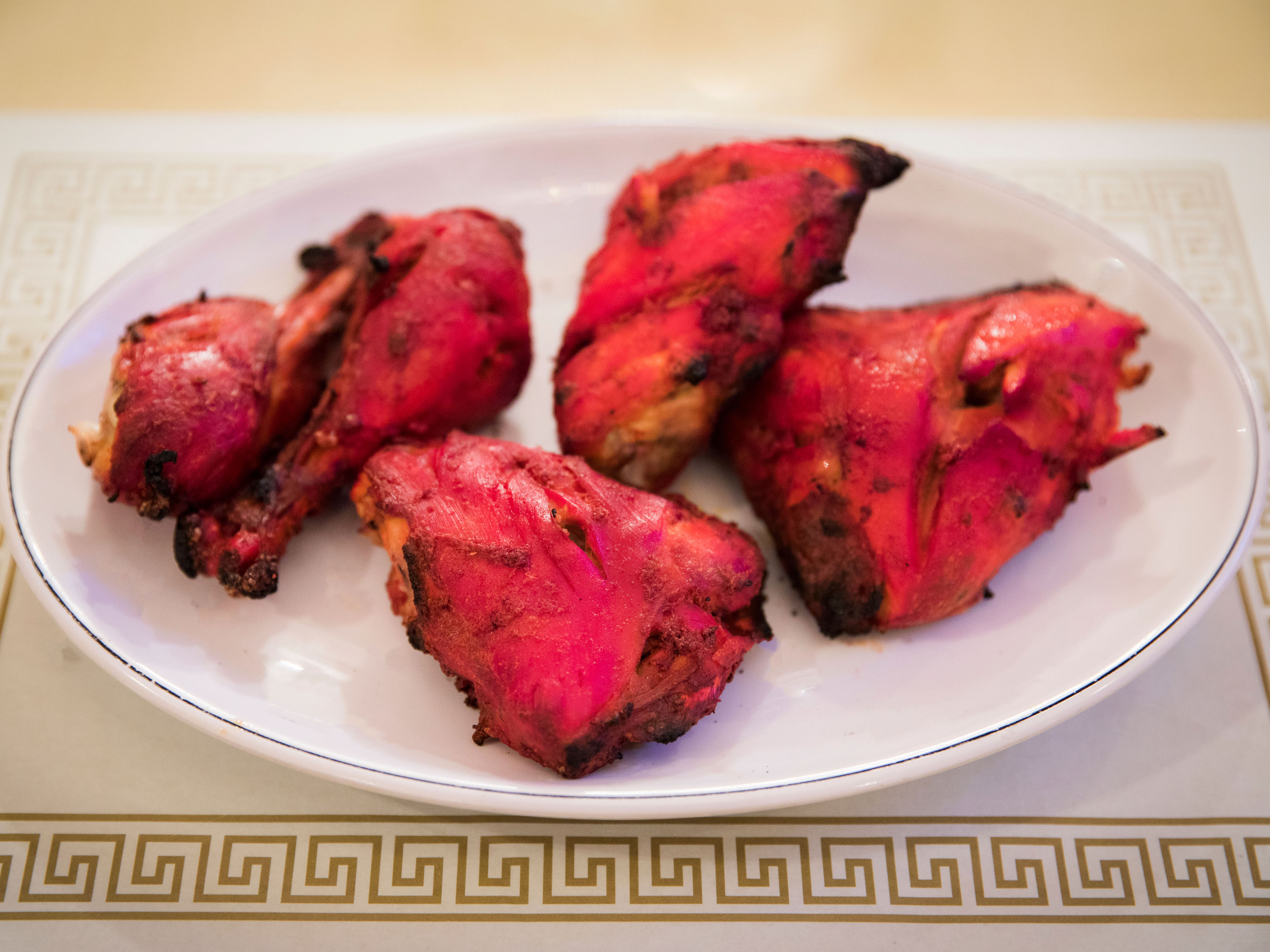 Order Chicken Tandoori with Bone  food online from Sitar Indian Cuisine store, Huntsville on bringmethat.com