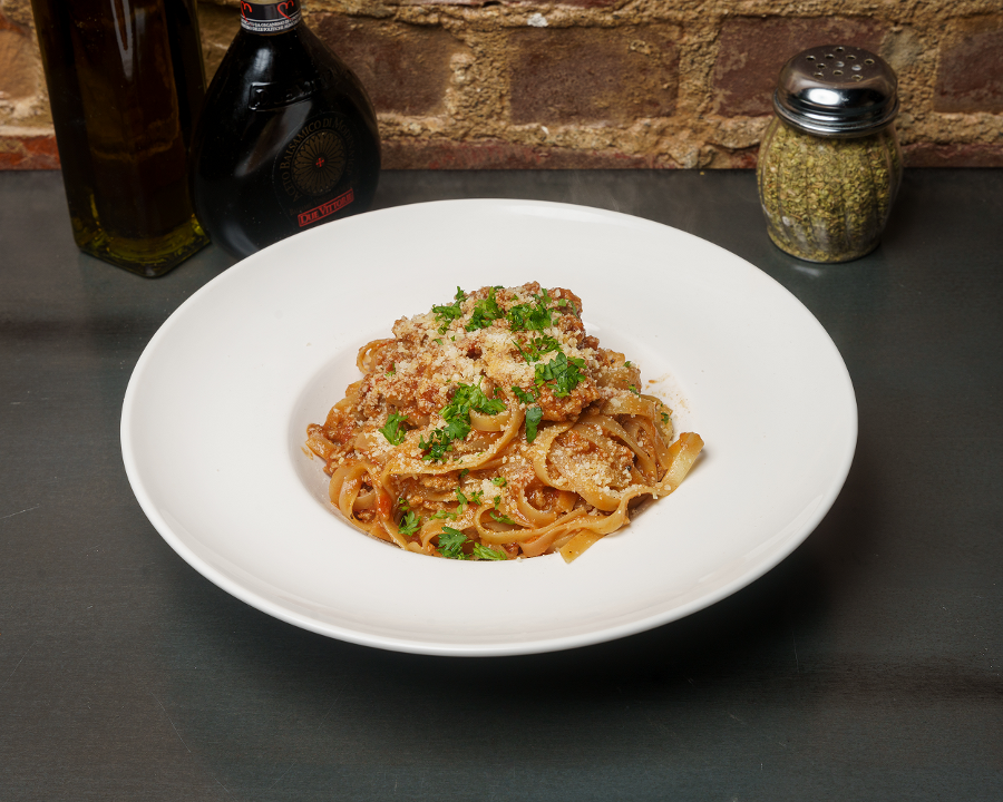 Order Tagliatelle Bolognese food online from Pizzeria Enzina store, Waltham on bringmethat.com