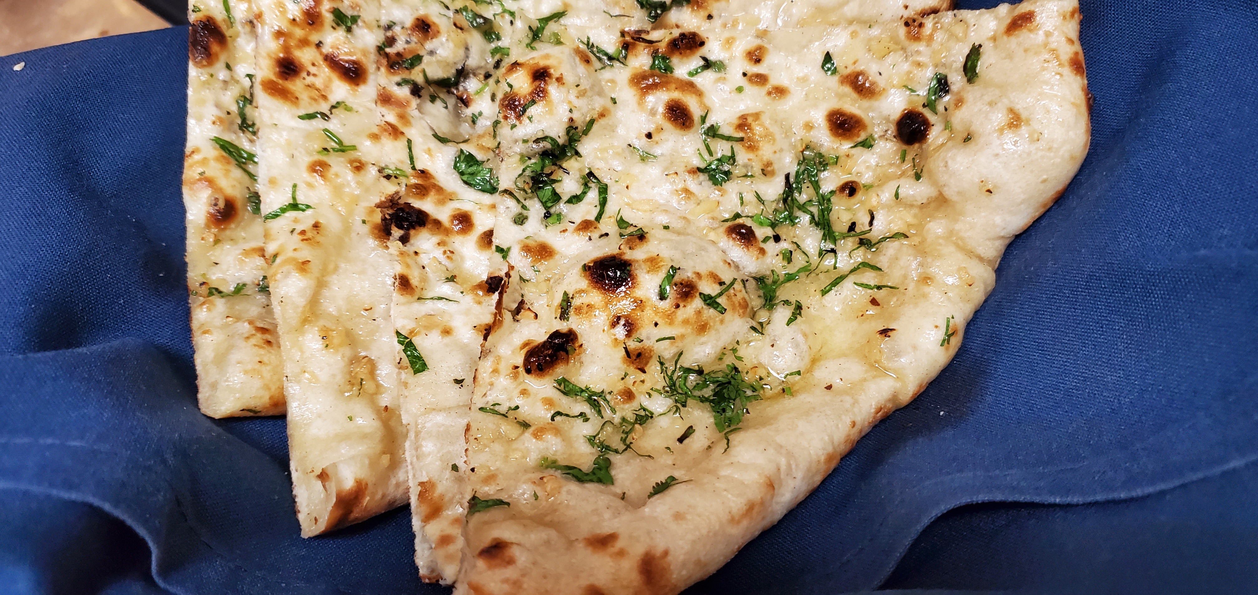 Order Naan with toppings food online from Spice Route store, Parsippany on bringmethat.com