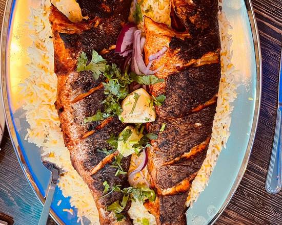 Order Whole Brozine grilled  Fish food online from Mashallah Sweets and Restaurant store, New York on bringmethat.com
