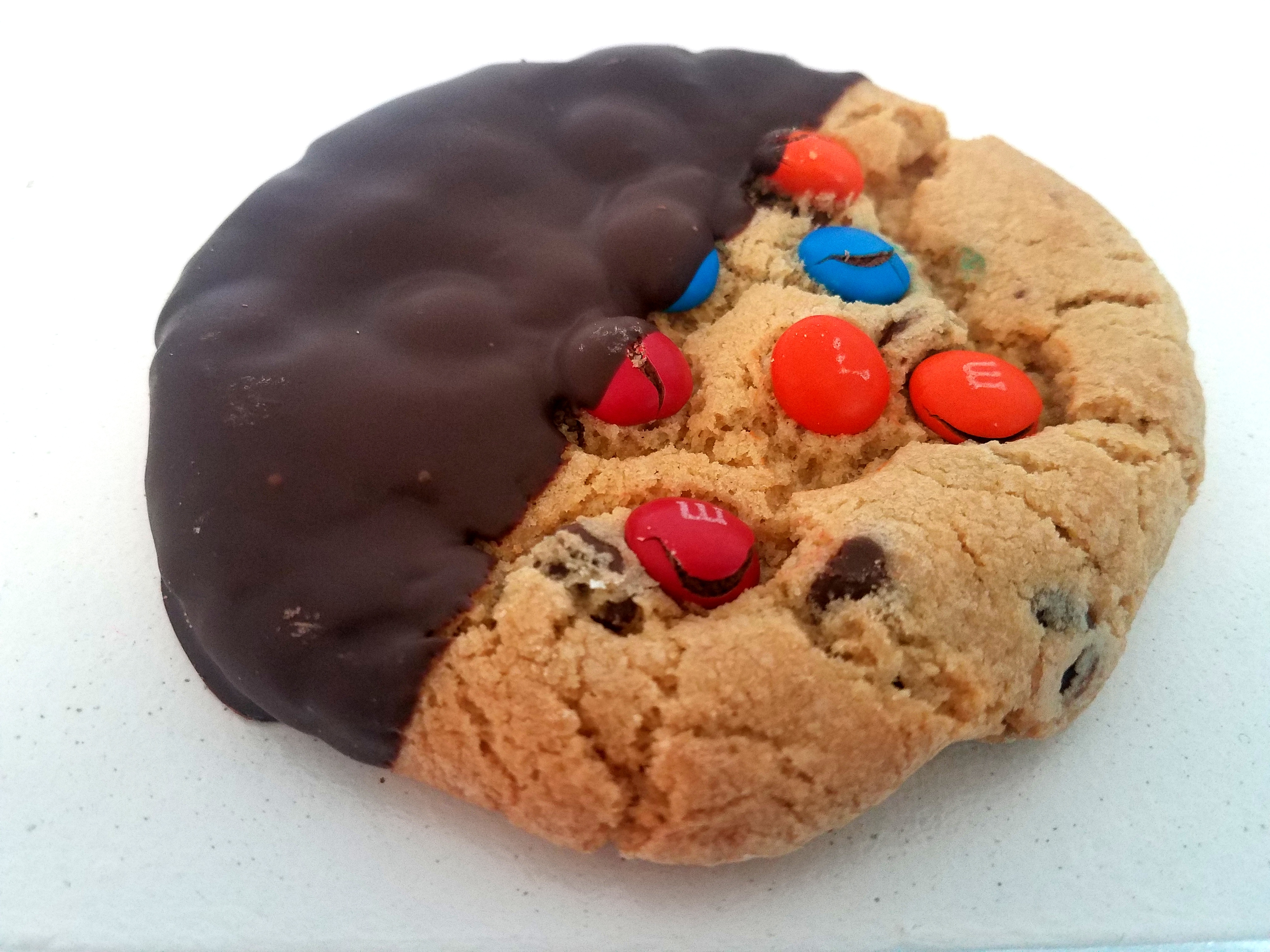 Order Dipped Chocolate Chip M&M food online from Twisted Cookie store, Forest Park on bringmethat.com