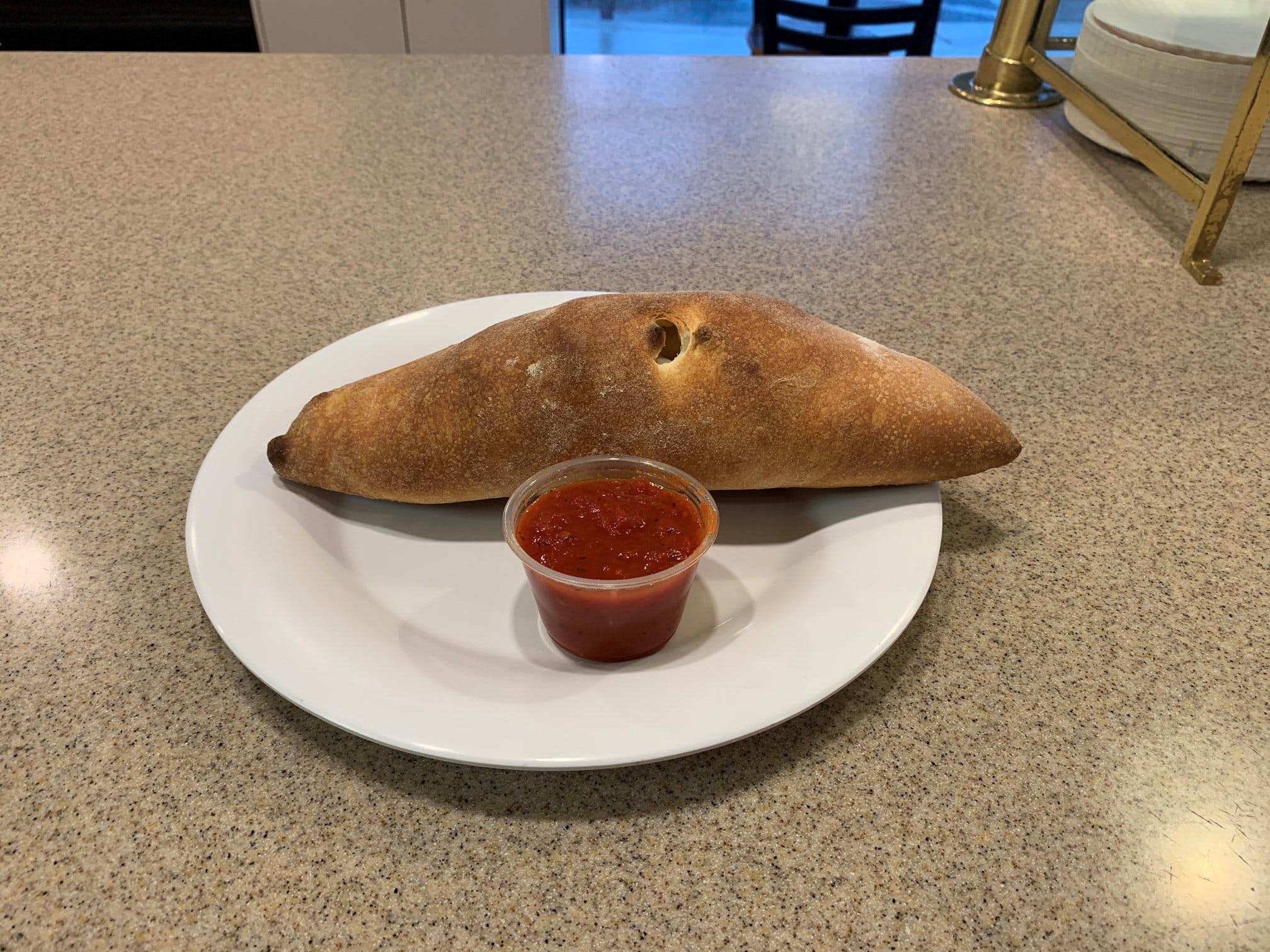 Order Calzone - Small food online from Toppings Pizza Company store, Frederick on bringmethat.com