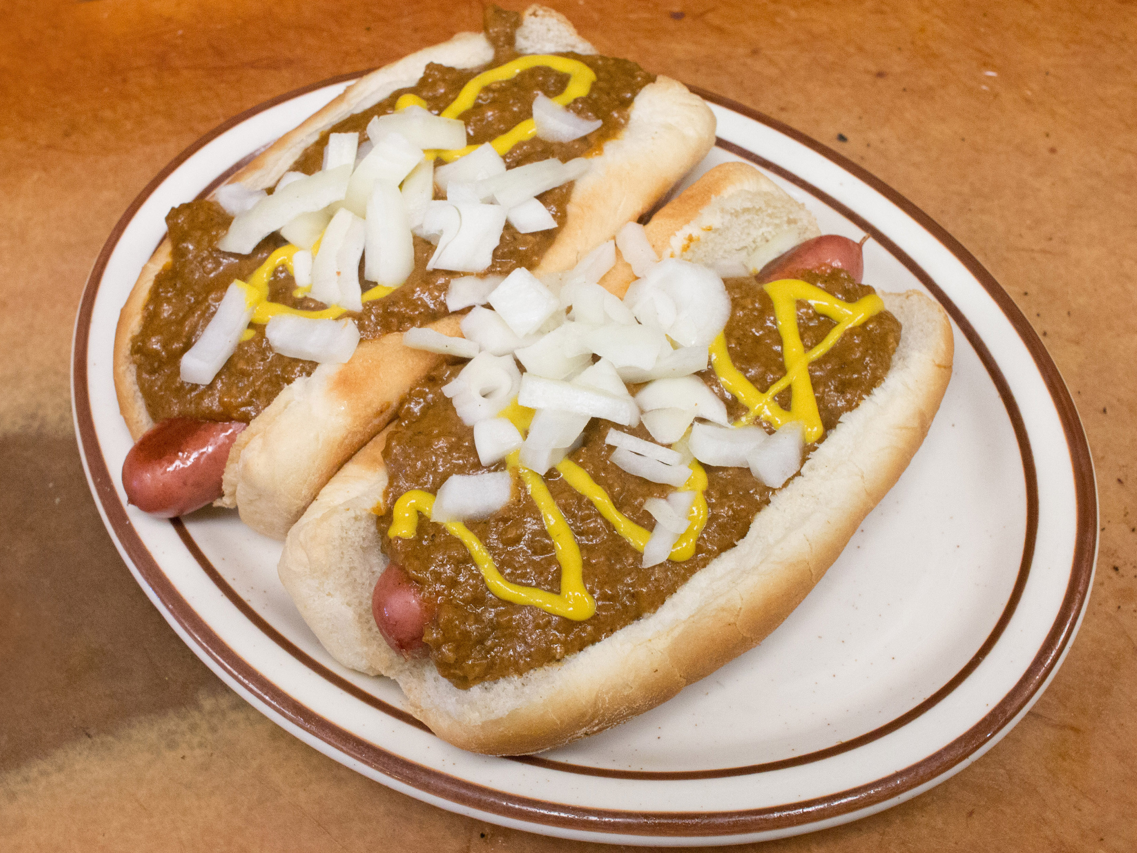 Order 2 Coney Hot Dogs and Fries with Large Pop food online from Leo's Coney Island store, South Lyon on bringmethat.com