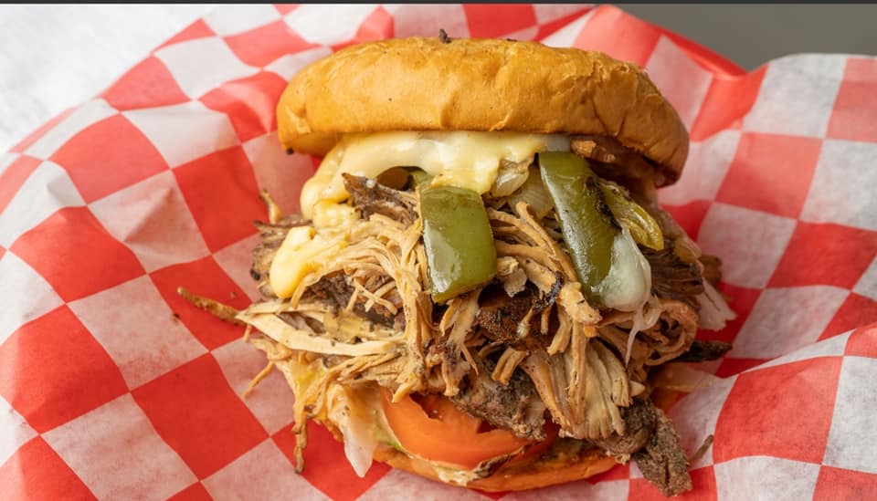 Order Jamaican Jerk Deluxe Sandwich food online from Get It On A Bun At Bootys store, New Albany on bringmethat.com