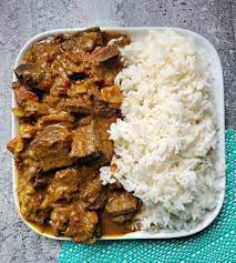 Order Curry Goat food online from Saint Bess Jerk Hub store, Norwich on bringmethat.com