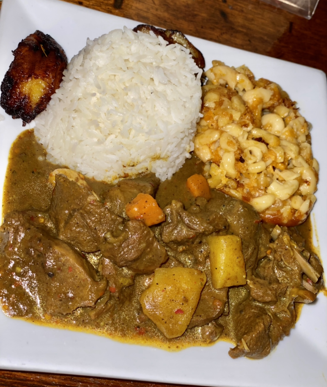 Order Curry Goat food online from Get It Inn Island Cuisine Ii store, Baltimore on bringmethat.com