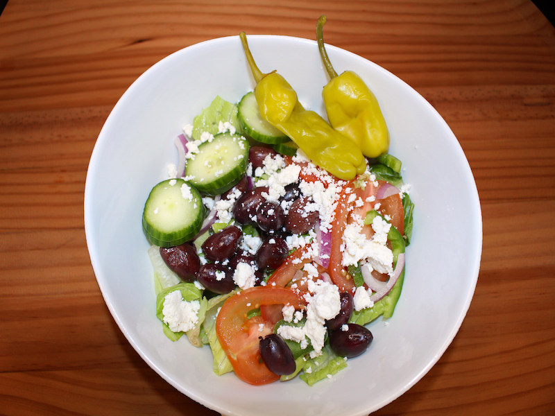 Order Greek Salad food online from Stefano's Pizza Express store, Pharr on bringmethat.com