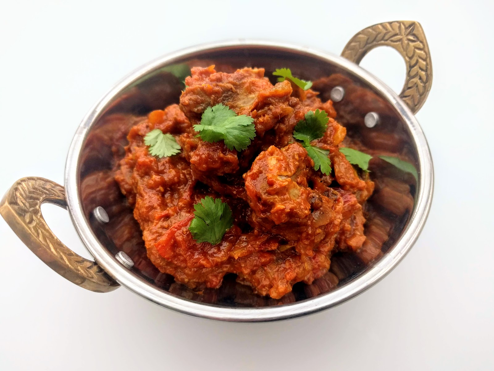Order Goat Bhuna food online from Chaska Fine Indian Cuisine store, Jersey City on bringmethat.com
