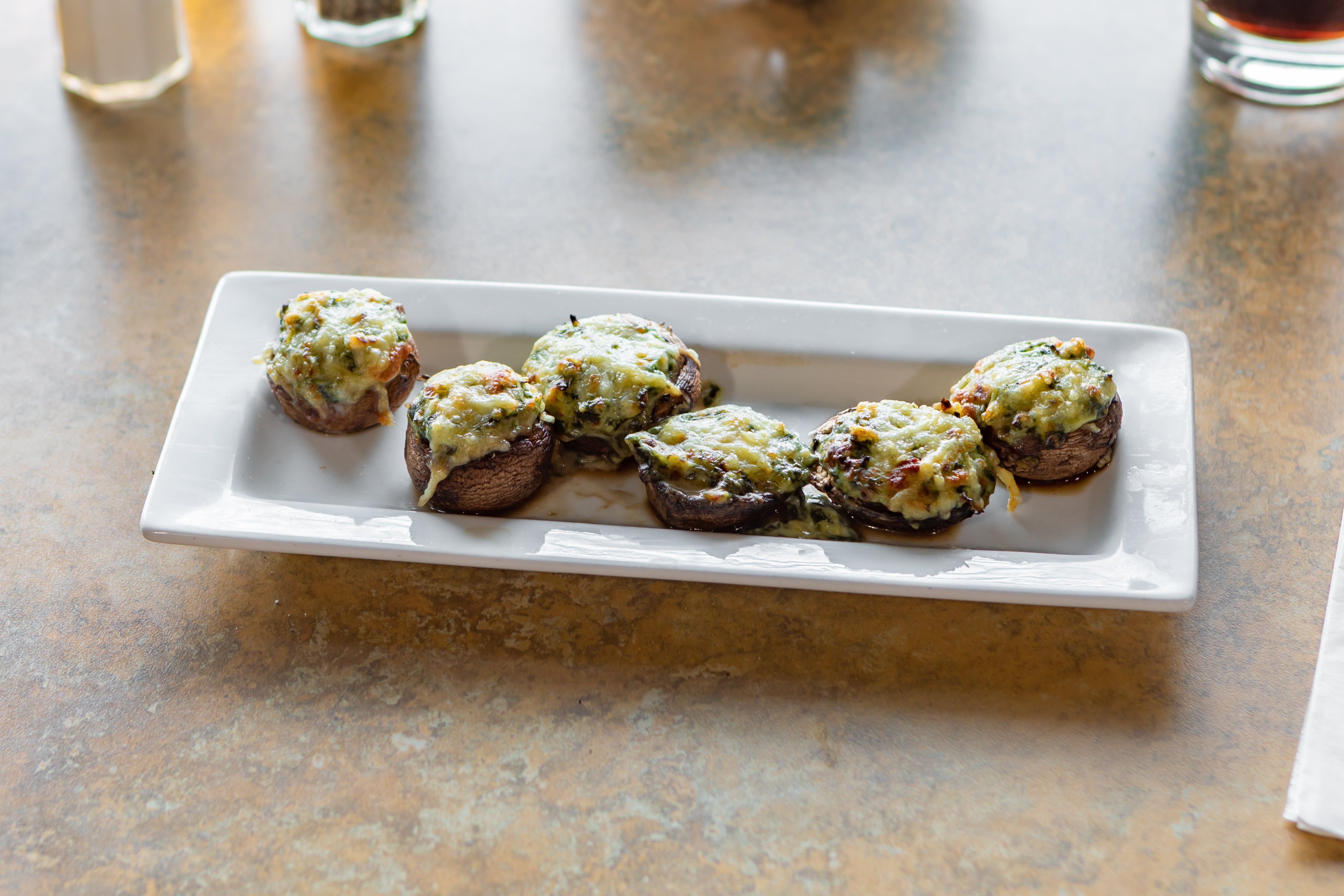 Order Stuffed Mushrooms - 6 Pieces food online from Saucy's Pizzeria store, Hillsboro on bringmethat.com