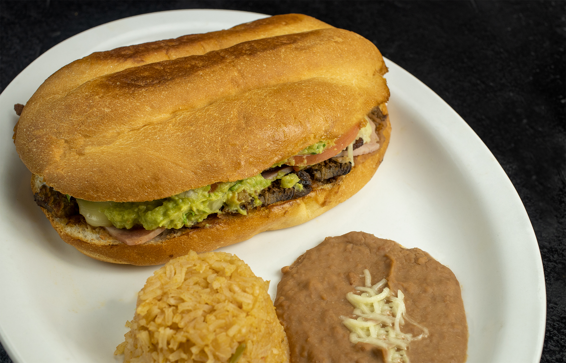 Order Tortas Platter with Rice & Beans food online from Taqueria Los Paisanos store, Saint Paul on bringmethat.com