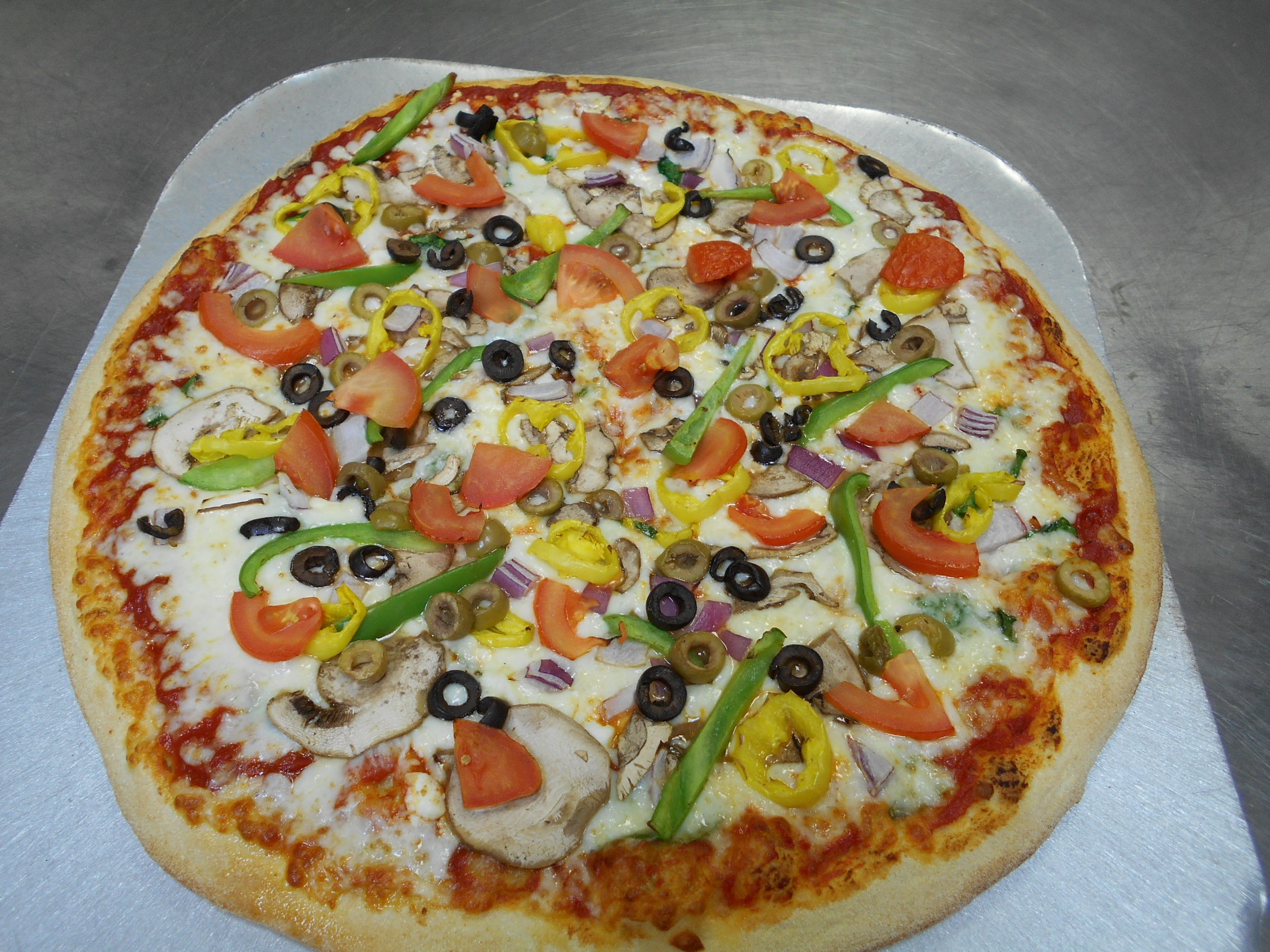 Order Veggie Supreme food online from Mama Mary Pizza store, Holland on bringmethat.com
