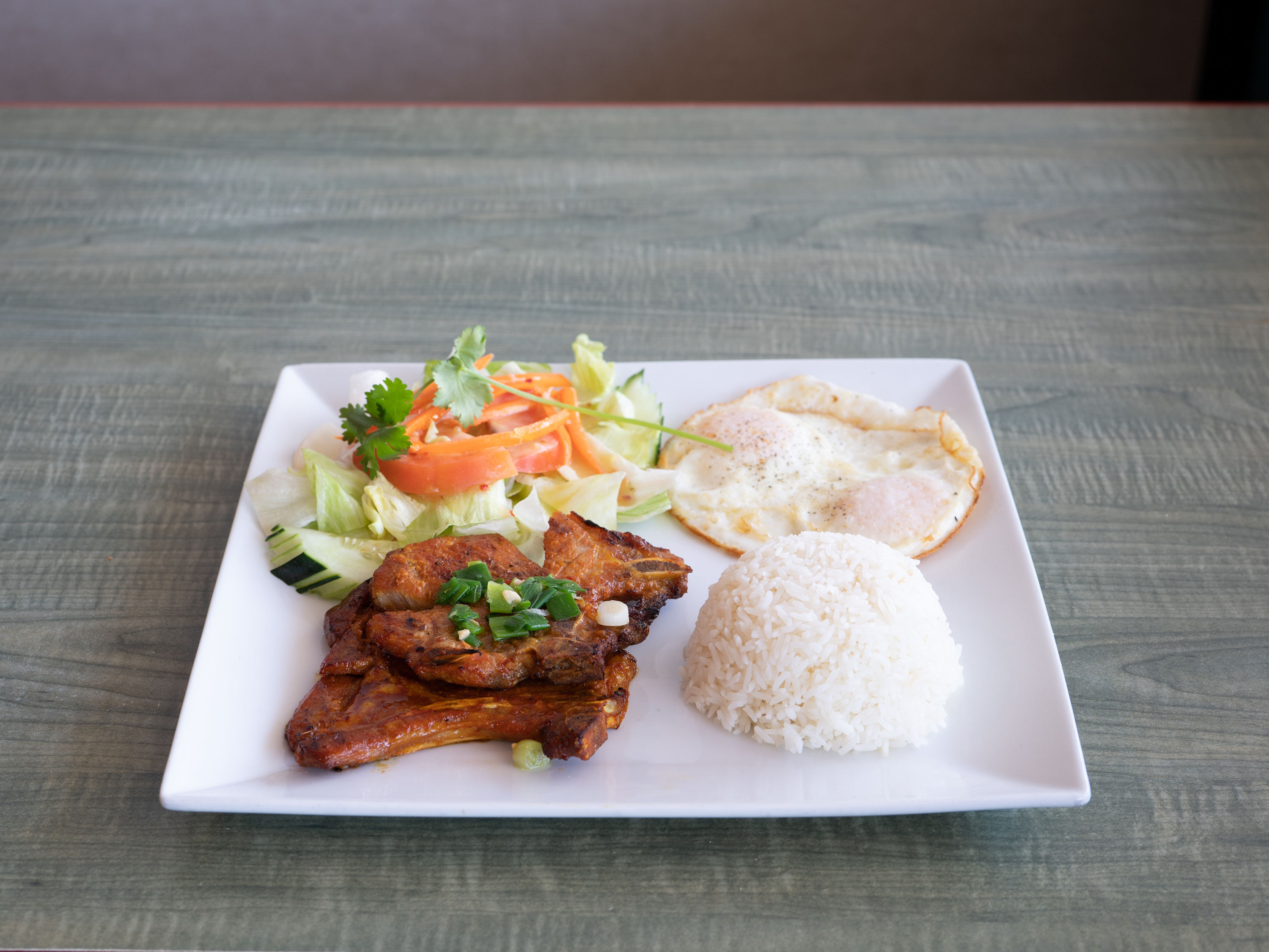 Order Grilled Pork Chop / Suon Nuong food online from Happy Pho store, Costa Mesa on bringmethat.com