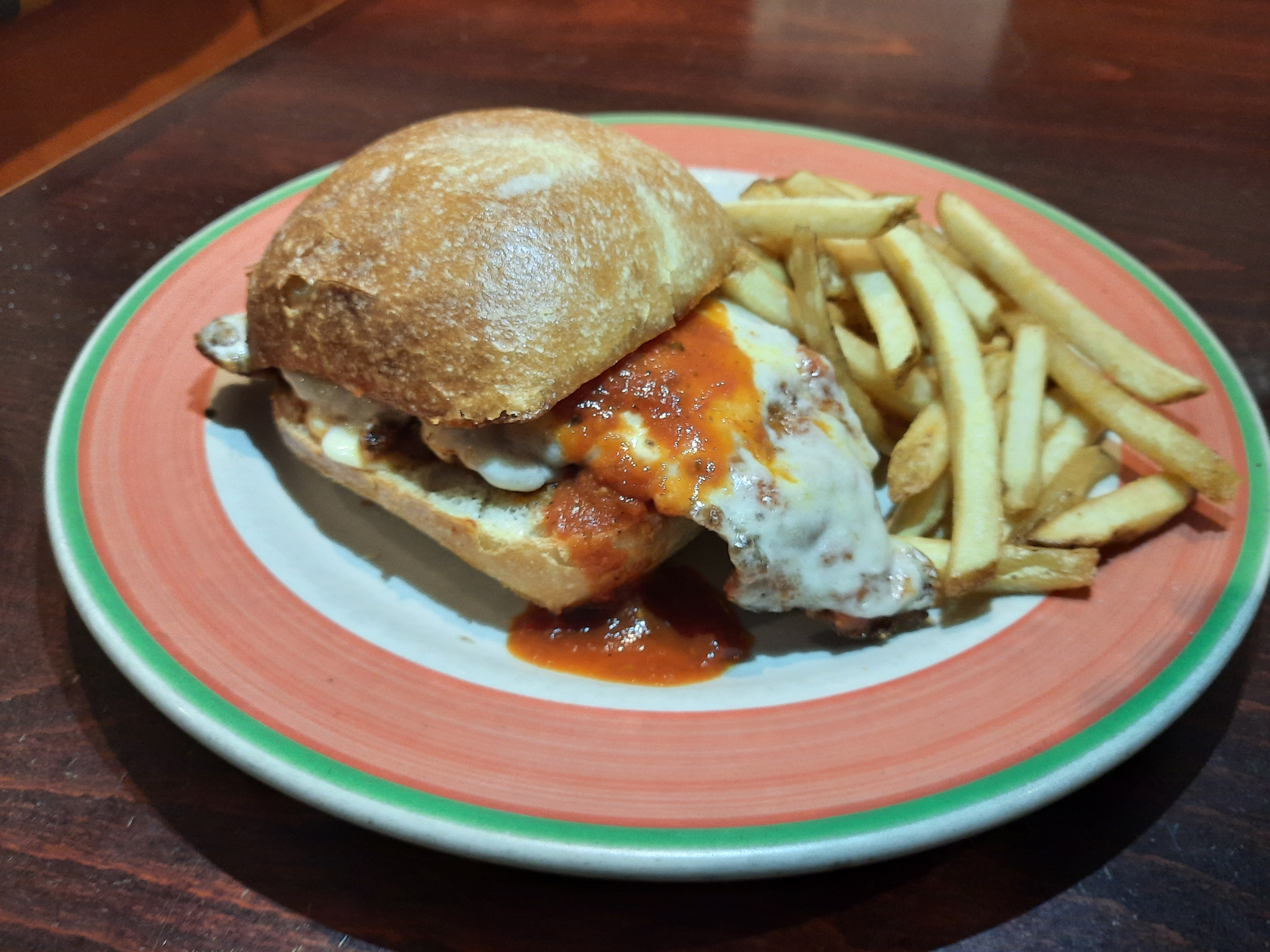 Order Chicken Parmigiano on a roll w seasoned French fries food online from Galaxy Diner store, New York on bringmethat.com