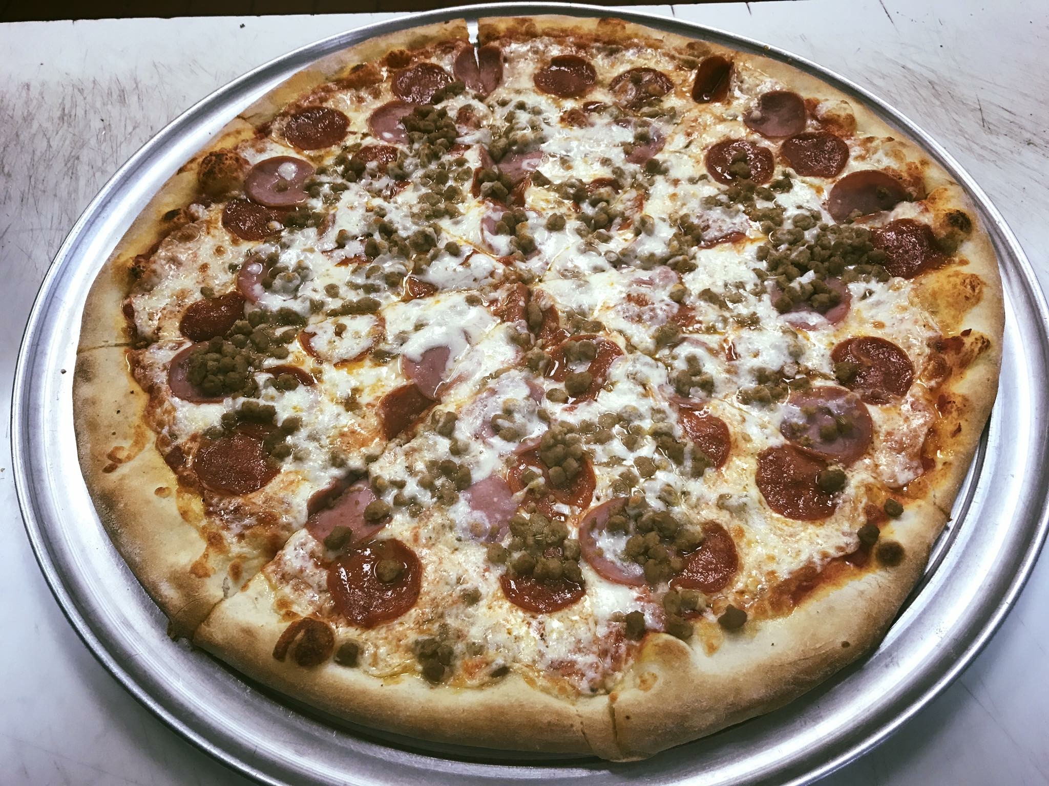 Order Meatlover's Pizza food online from Tuscany Italian Bistro store, Richardson on bringmethat.com