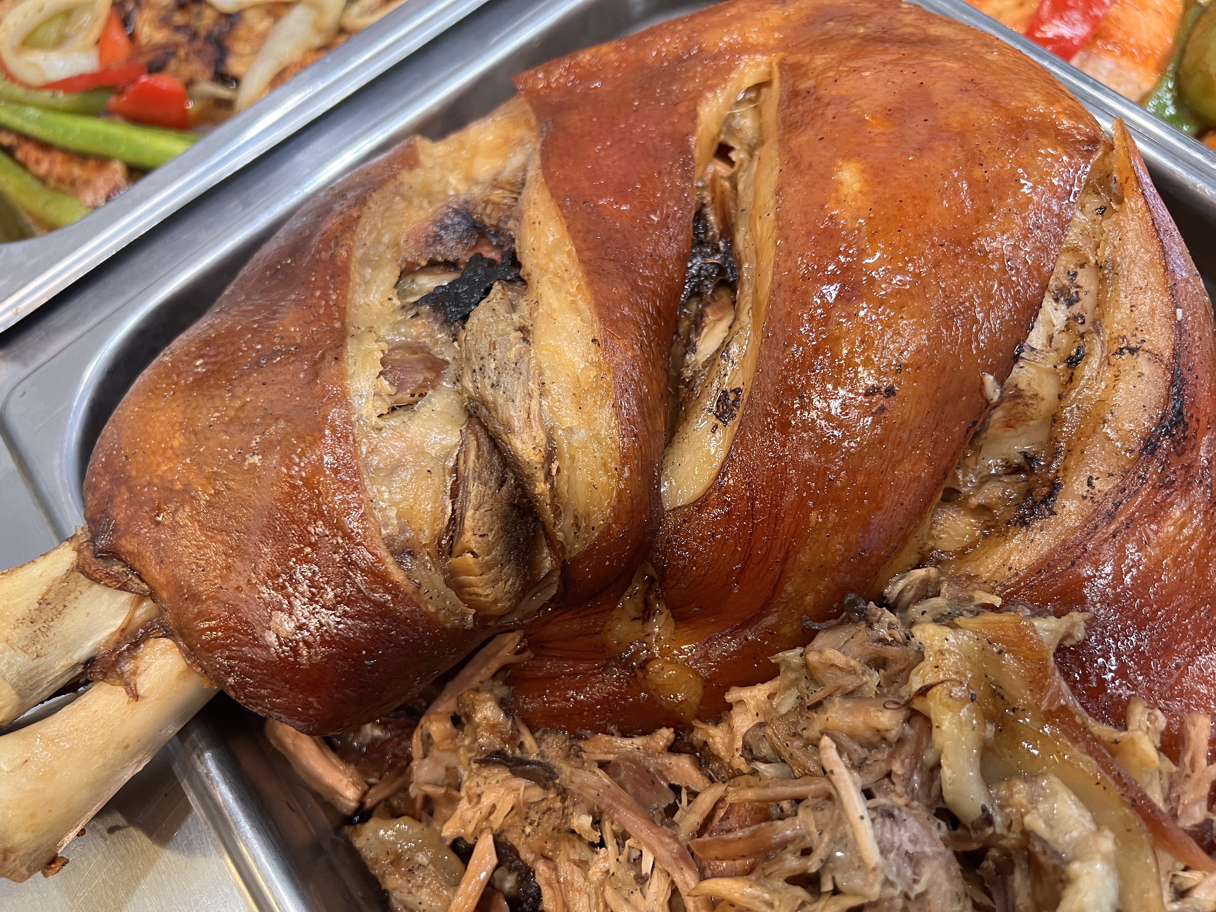 Order Whole roasted pork (Pernil) food online from Lula's Latin Cuisine store, Bergenfield on bringmethat.com
