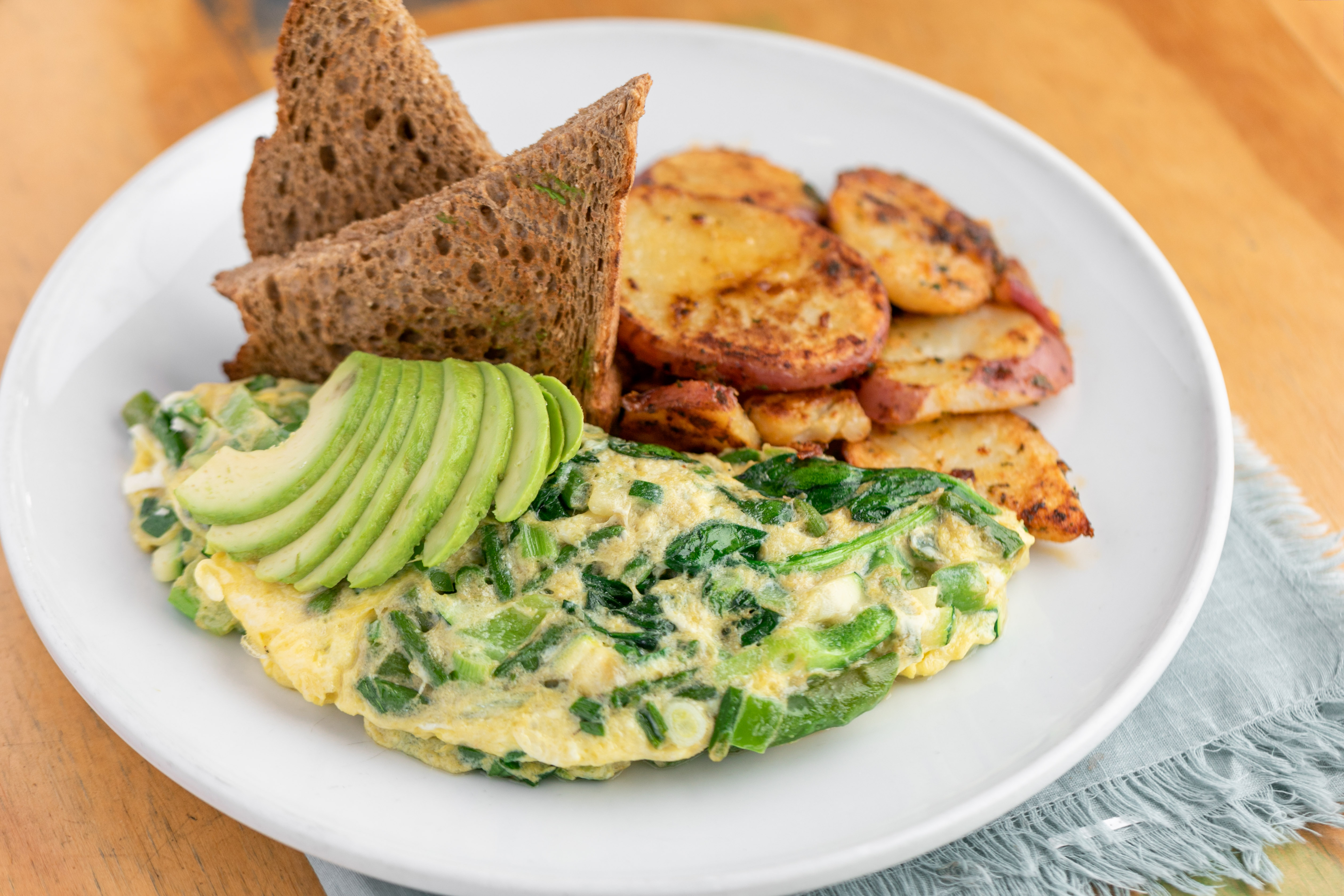 Order The Green Omelet* food online from Swami Cafe store, San Diego on bringmethat.com