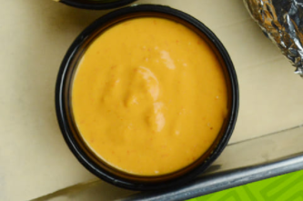 Order 4 oz. Cheese Dipping Sauce food online from Taco Teresa store, Minnetonka on bringmethat.com