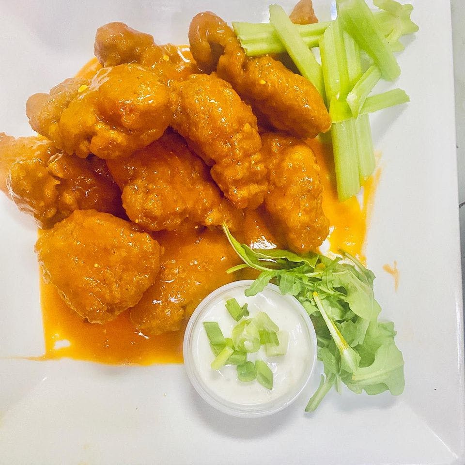 Order Boneless Buffalo Wings - 10 Pieces food online from Little Italy store, Washington on bringmethat.com