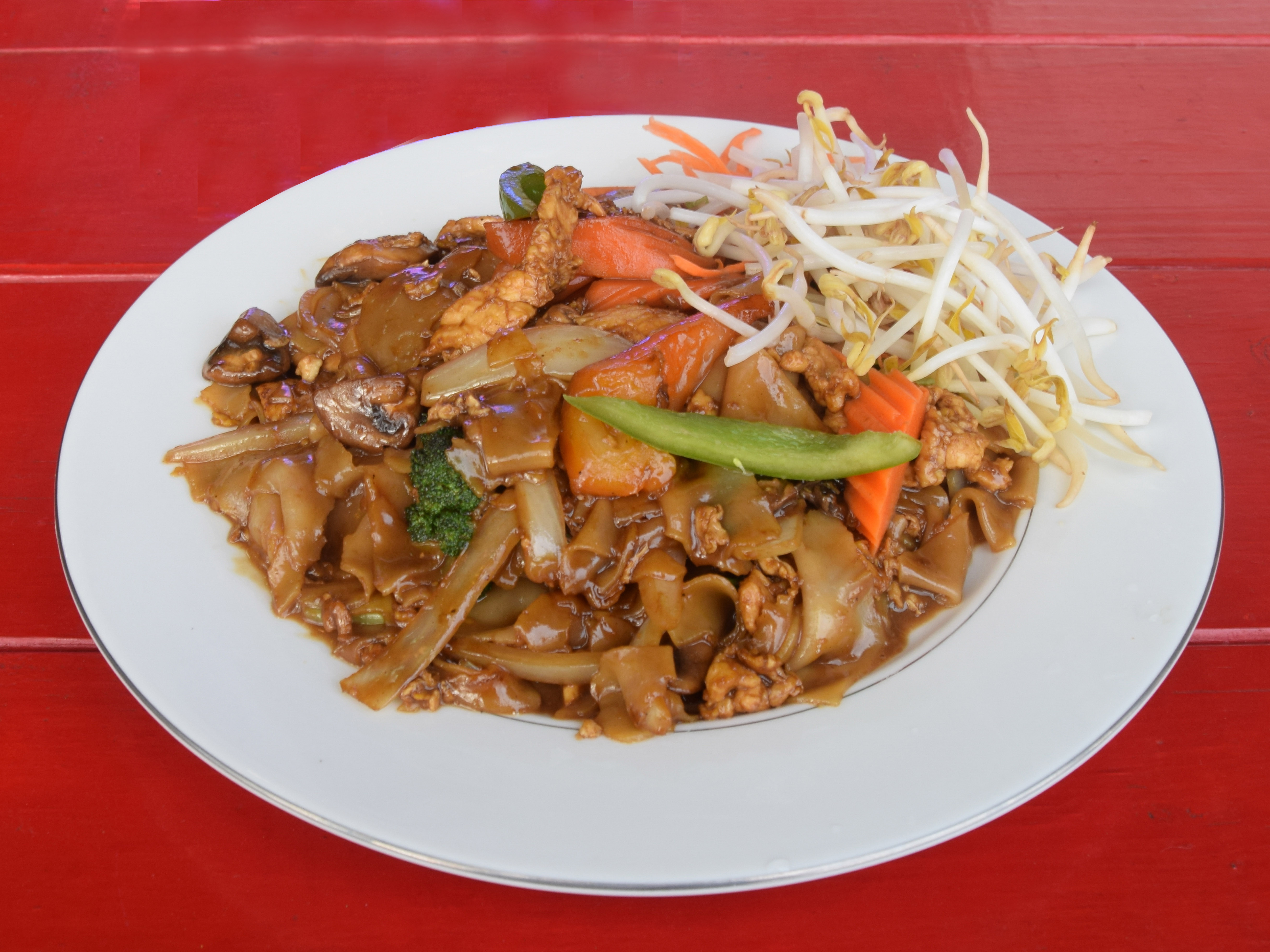 Order 4. Pad Kee Mao Noodles food online from Thai Garden To Go store, Clackamas on bringmethat.com