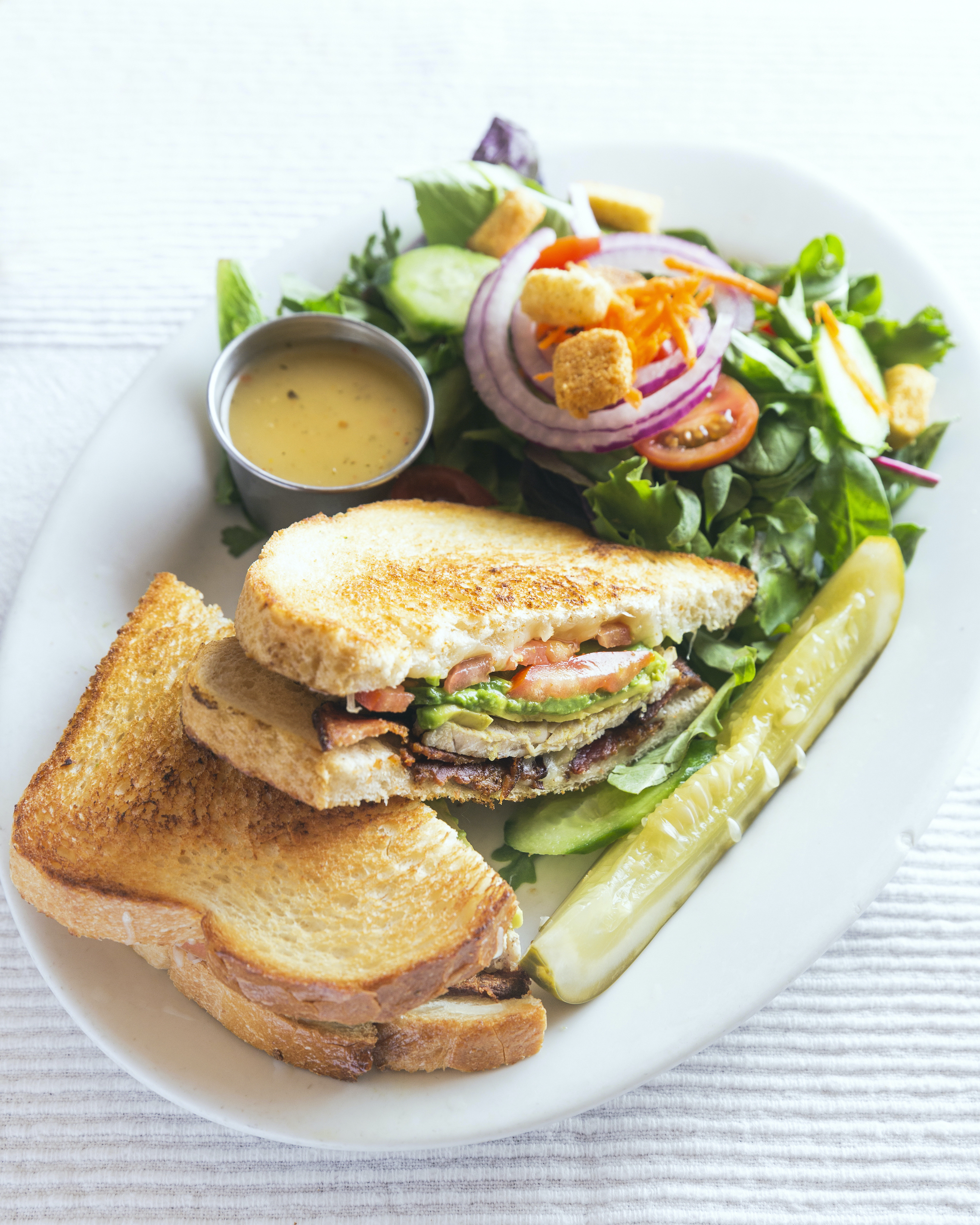 Order Turkey Avo Deluxe Sandwich food online from Pork Store Cafe Valencia 312216th store, San Francisco on bringmethat.com