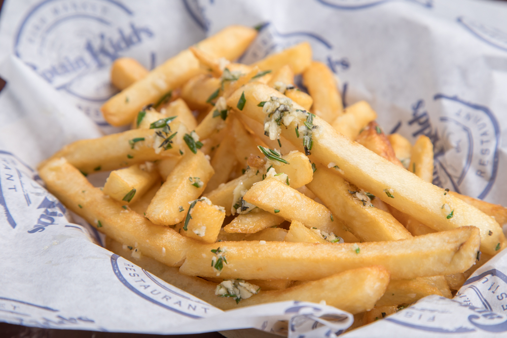 Order Garlic French Fries-Side food online from Captain Kidds Fish Market & Restaurant store, Redondo Beach on bringmethat.com