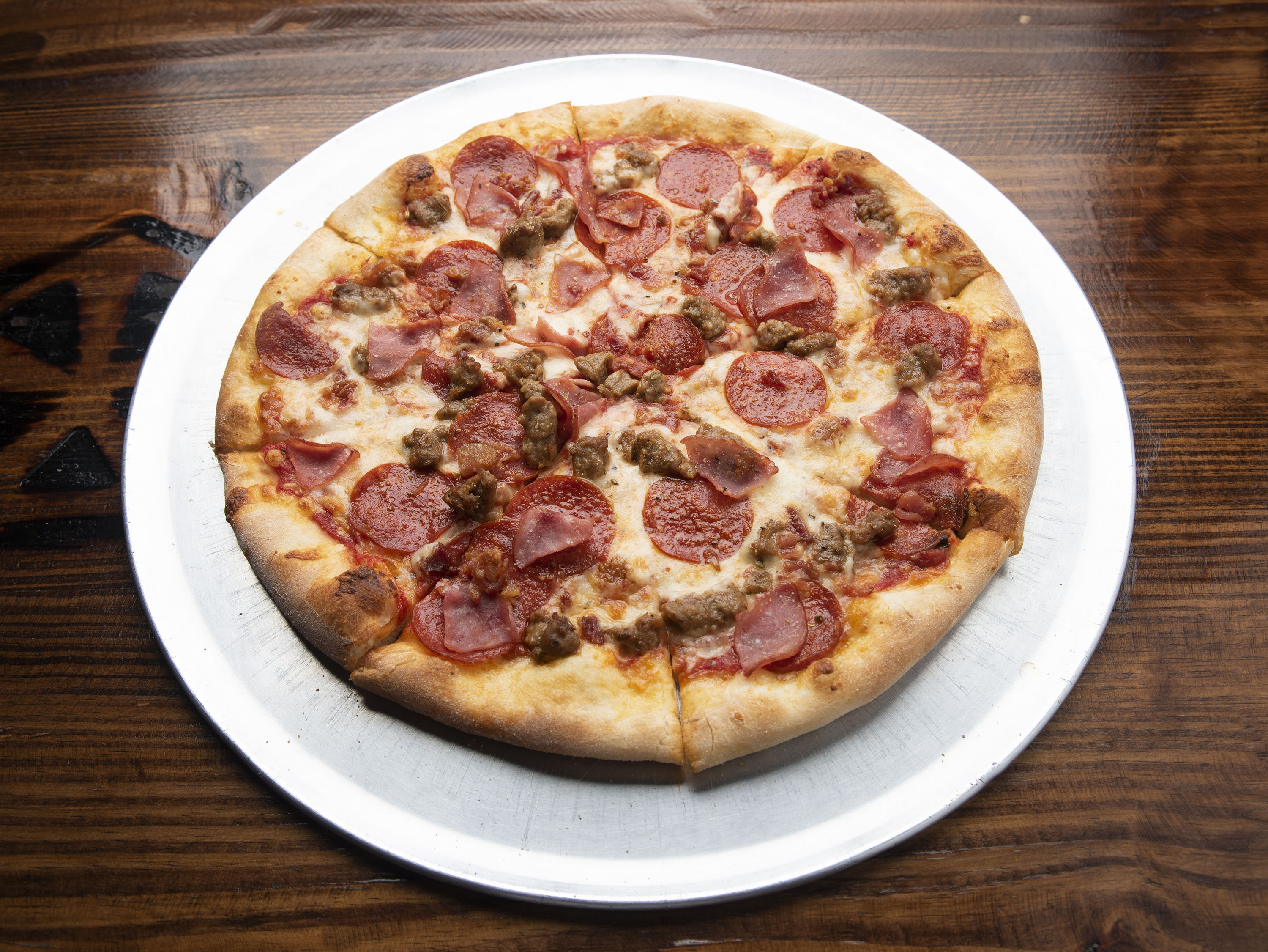Order Meat Lovers Pizza food online from The Pizzeria - W. University Dr. store, Edinburg on bringmethat.com