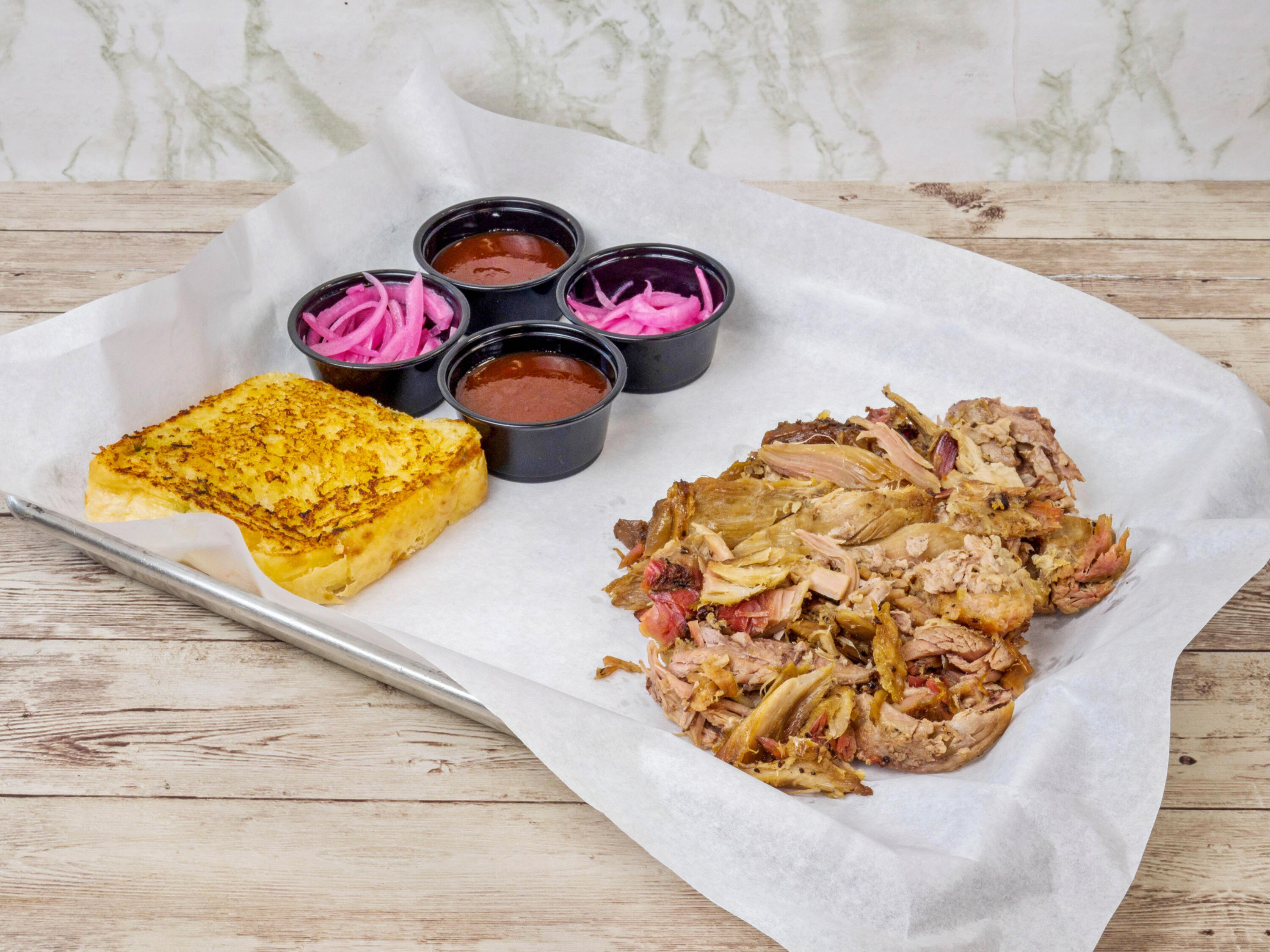 Order 1 lb. Pulled Pork food online from The Smoking Joint store, Cypress on bringmethat.com
