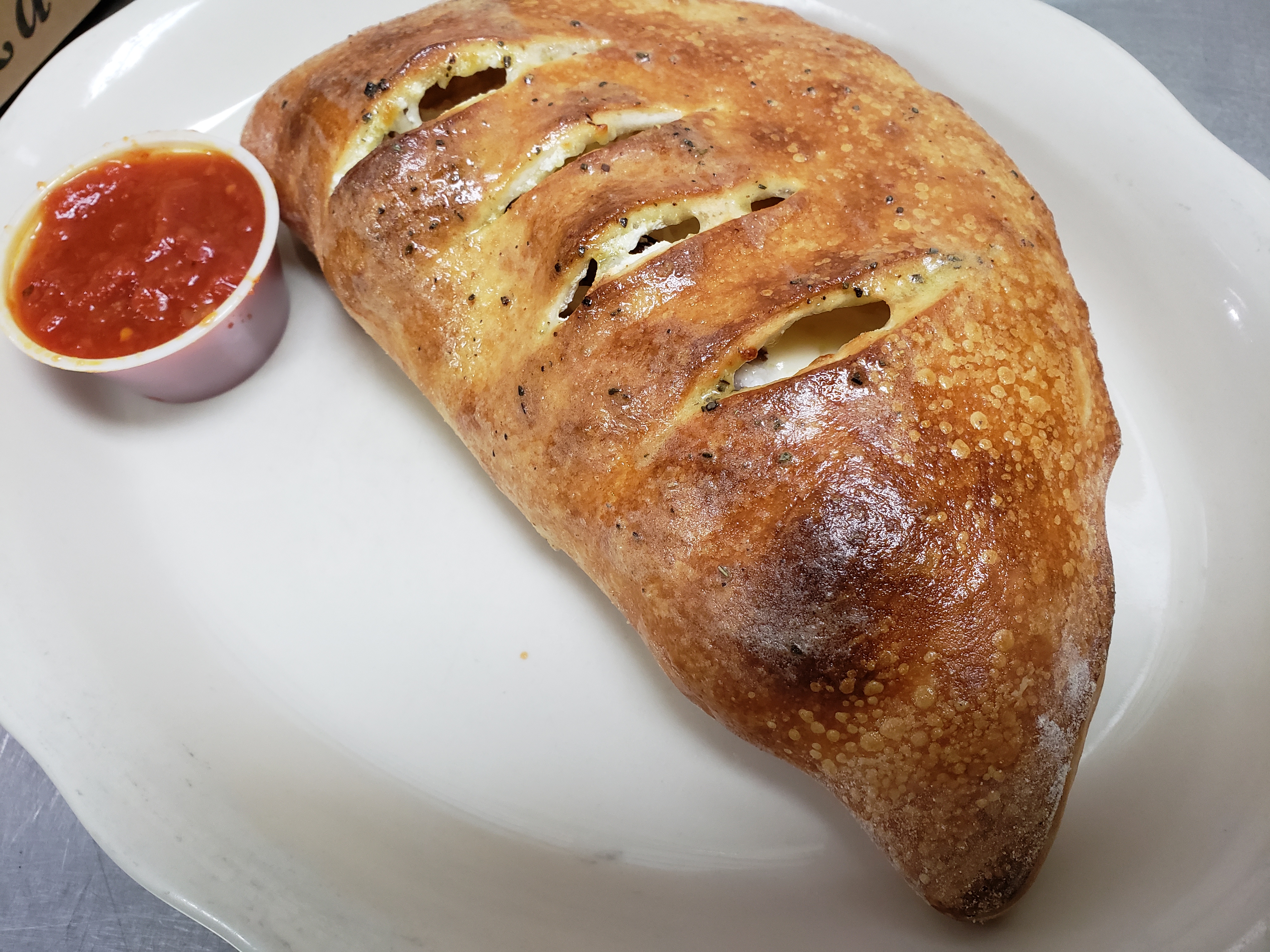 Order Chicken Calzone food online from Illianos Pizza store, Clemmons on bringmethat.com