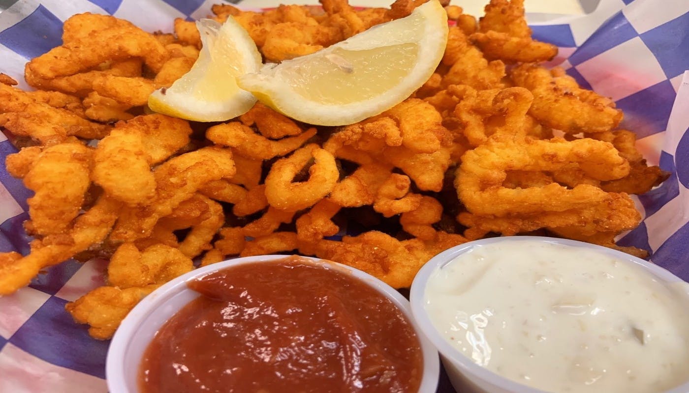 Order Clam Strips Side Order - 1 lb. food online from Village Pizza and Seafood store, Pasadena on bringmethat.com