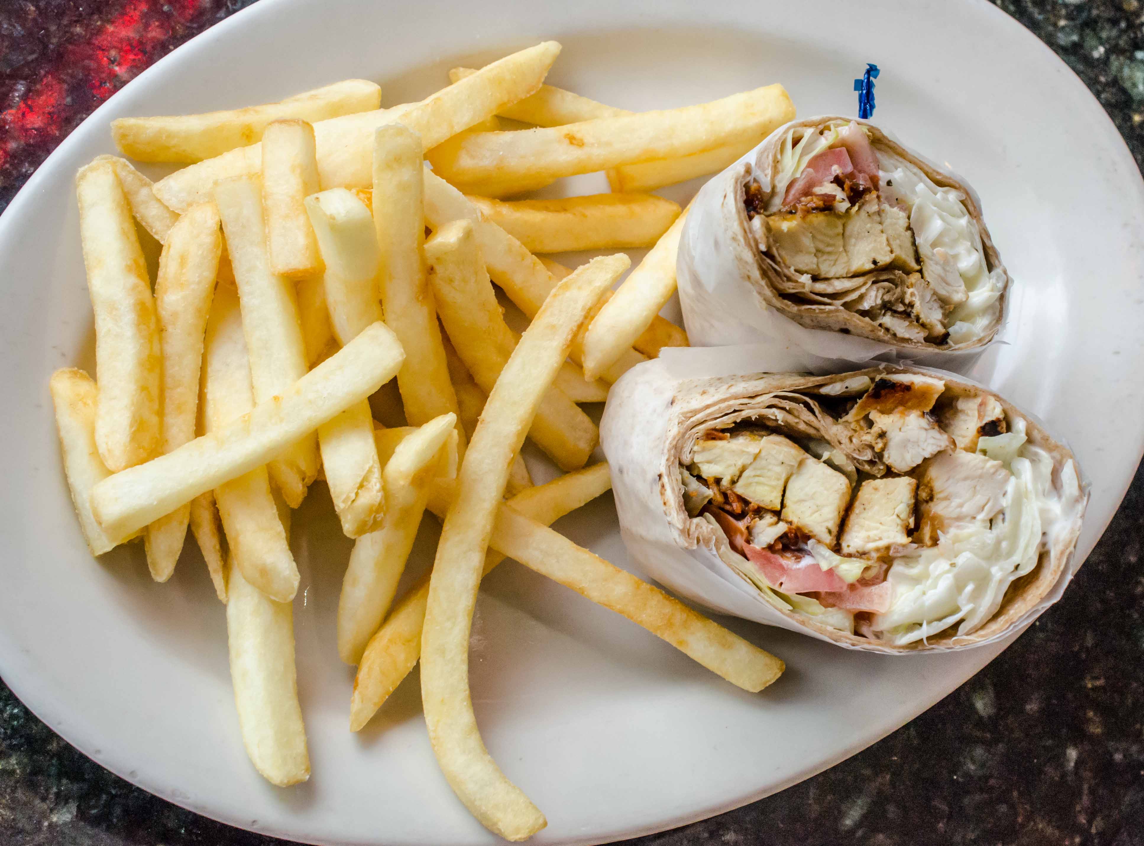 Order Grilled Chicken Caesar Wrap food online from Perista Coffee Shop and Restaurant store, Bronx on bringmethat.com