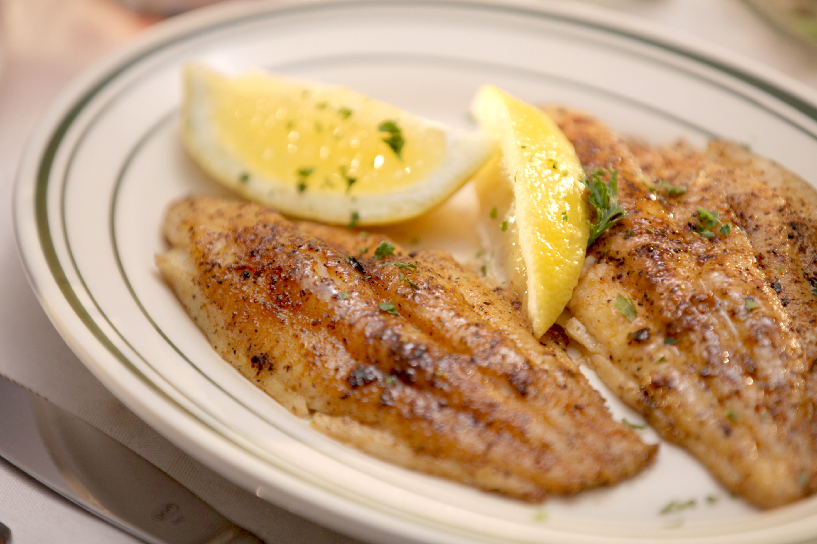 Order Grilled Blackened Catfish food online from Poorboy's Riverside Inn store, Broussard on bringmethat.com