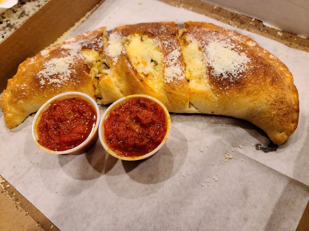 Order Meat Lover's Stromboli - Small food online from Apollos Pizza store, Richmond on bringmethat.com