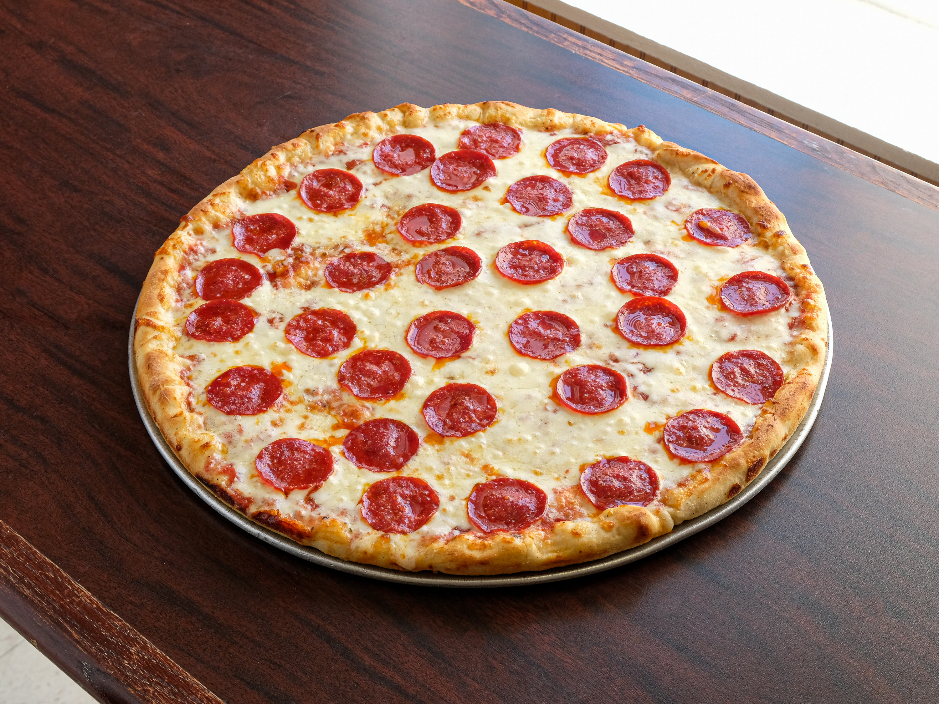 Order 2 large pepproni pizZa food online from Semo's store, Wilmington on bringmethat.com