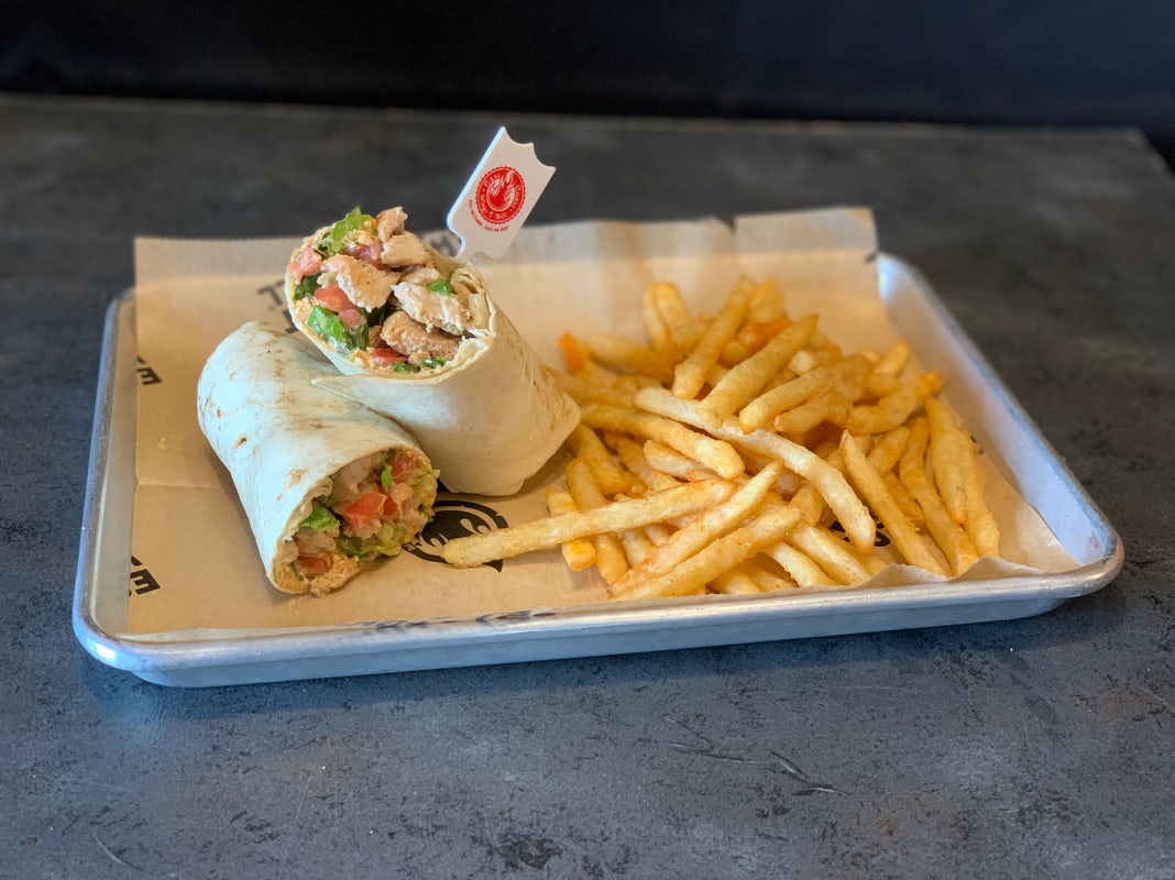 Order ECW+G Buffalo Chicken Wrap™ food online from East Coast Wings + Grill store, High Point on bringmethat.com